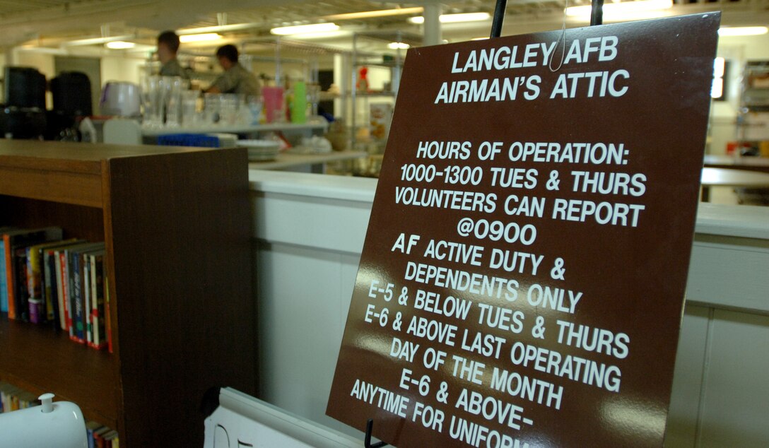 LANGLEY AIR FORCE BASE, Va. -- A sign outlining the Airman’s Attic’s hours of operations and store policies is displayed near the checkout register Aug. 19. Volunteers provided more than 16,800 man hours of renovations over seven days, installing new kitchen tiles, repainting aging walls, re-carpeting and power-washing floors, and removing unneeded walls and glass. (U.S. Air Force photo/Airman 1st Class Jason J. Brown)