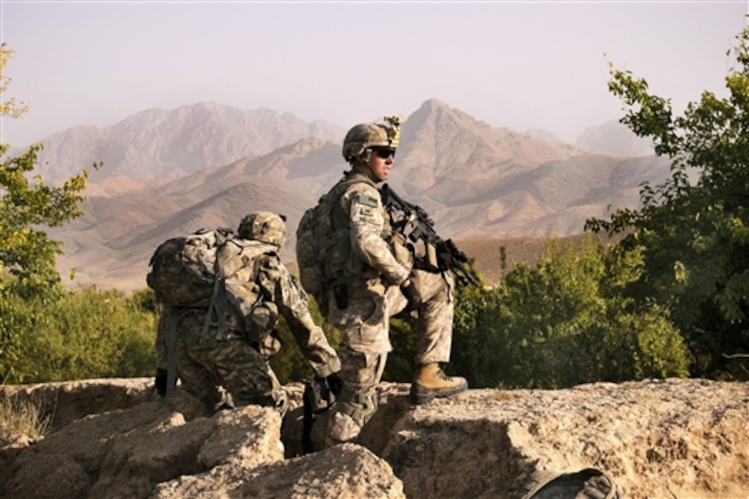 U.S. Army soldiers provide security during a village meeting near Combat Outpost Mizan in Mizan district, Zabul province, Afghanistan, Aug. 19, 2010. The soldiers are assigned to Company F, 2nd Squadron, 2nd Stryker Cavalry Regiment. Members of the Zabul Provincial Reconstruction Team and U.S. soldiers talked with Afghan citizens in the area to assess their needs and discuss upcoming provincial elections.