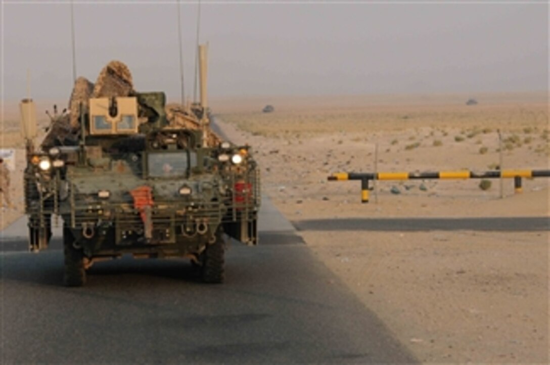 U.S. Army soldiers with Fox Company, 52nd Infantry Regiment, 2nd Battalion, 12th Field Artillery Regiment, 4th Stryker Brigade Combat Team, 2nd Infantry Division cross from Iraq into Kuwait on Aug. 15, 2010.  