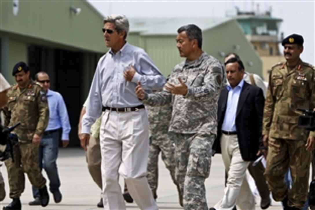 U.S. and Pakistani military discuss flood relief efforts with U.S. Sen. John Kerry of Massachusetts as he visits Ghazi aviation base in Khyber-Pakhtunkhwa province, Pakistan, Aug. 19, 2010. The U.S. Marines are assigned to the 15th Marine Expeditionary Unit.