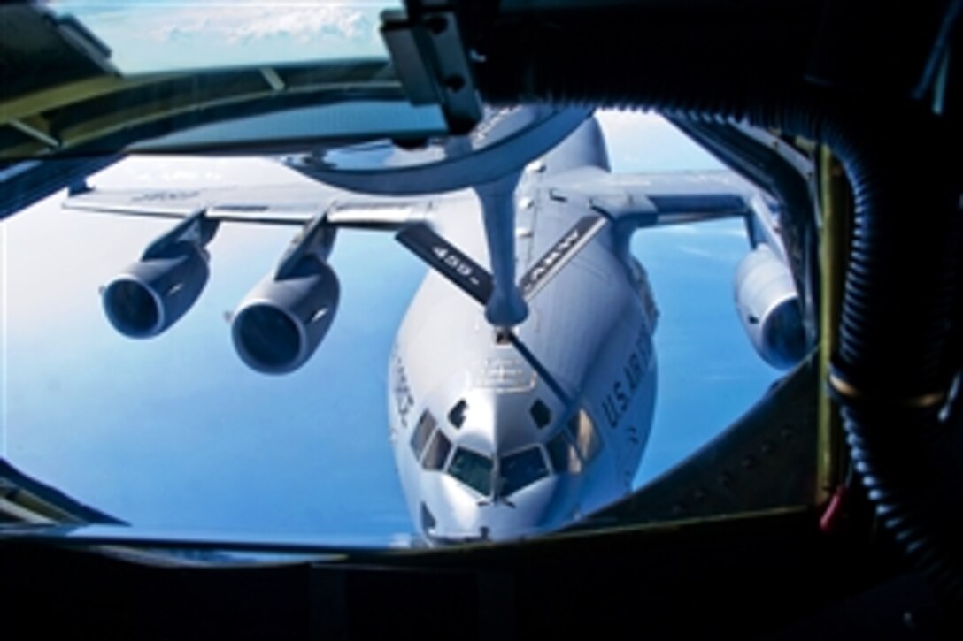 U.S. Air Force airmen assigned to the Air Force Reserve Command's 459th Air Refueling Wing refuel a C-17 Globemaster III over Joint Base Andrews, Md., Aug. 14, 2010.