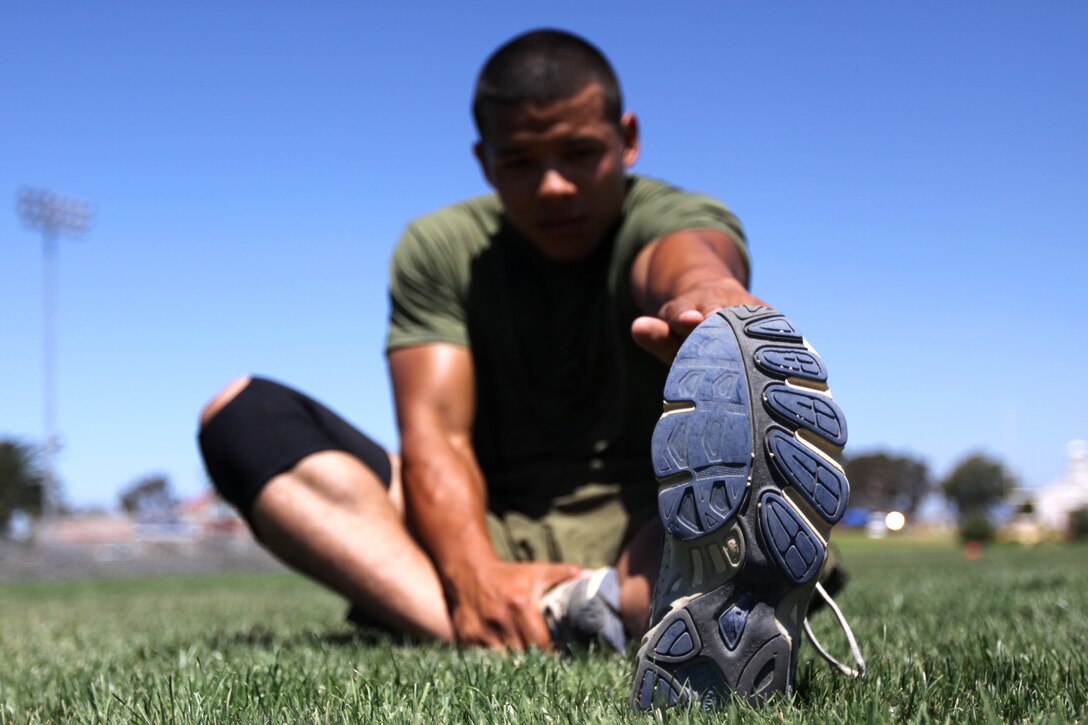 Pfc. Jesse A. Cabral, administrative clerk, Headquarters and Support Battalion, Marine Corps Base Camp Pendleton, and participant in the 500 Mile Club, stretches before conducting his daily run. The 500 Mile Club is a program offered by Marine Corps Community Services’ Semper Fit division for service members interested in improving their run time and adding an edge to their physical fitness level.