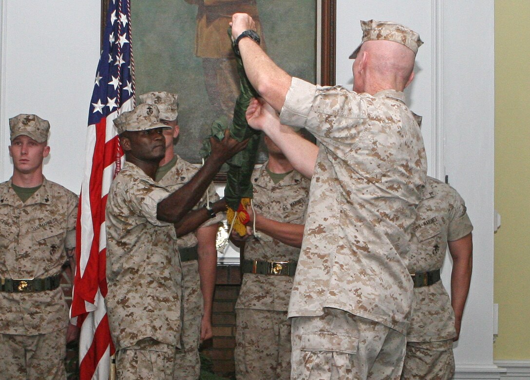Maj. Gen. John A. Toolan (right), commanding general of II Marine Expeditionary Force (Forward), and Sgt. Maj. Michael F. Jones, sergeant major of II MEF (Fwd), uncase the II MEF (Fwd) colors, symbolizing the unit’s activation during a ceremony aboard Marine Corps Base Camp Lejeune, N.C., Aug. 20, 2010. This activation marks the fourth time since the Global War on Terror began in March 2003 that II MEF (Fwd) will take the lead for counter-insurgency and security and stability operations in the Middle East, but this will be the unit’s first time to do so in Afghanistan.