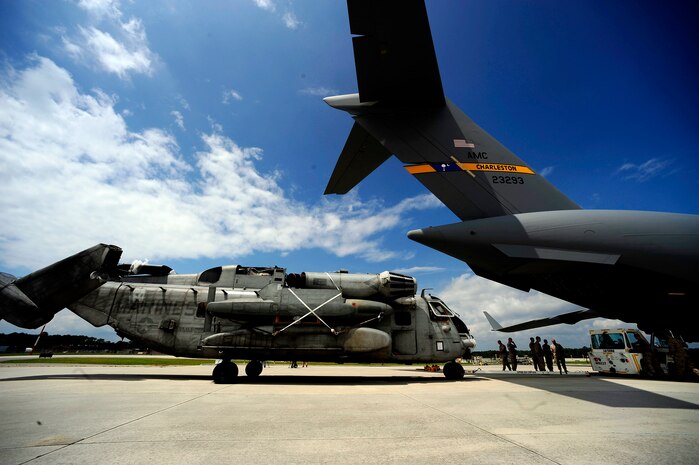 U.S. Marines assigned to the 26th Marine Expeditionary Unit (MEU) Marine Corps Air Station Cherry Point, N.C., along with U.S. Air Force members assigned to the 14th Air Lift Squadron, Joint Base Charleston, S.C. move a CH-53E Super Stallion onto a C-17 Globemaster III at Marine Corps Air Station Cherry Point, N.C., on August 20, 2010.  The helicopter is one of four that will be used to supplement U.S. military rescue and relief efforts in the flood affected areas of Pakistan.  (U.S. Air Force photo by Staff Sgt. Kamaile O. Long)
