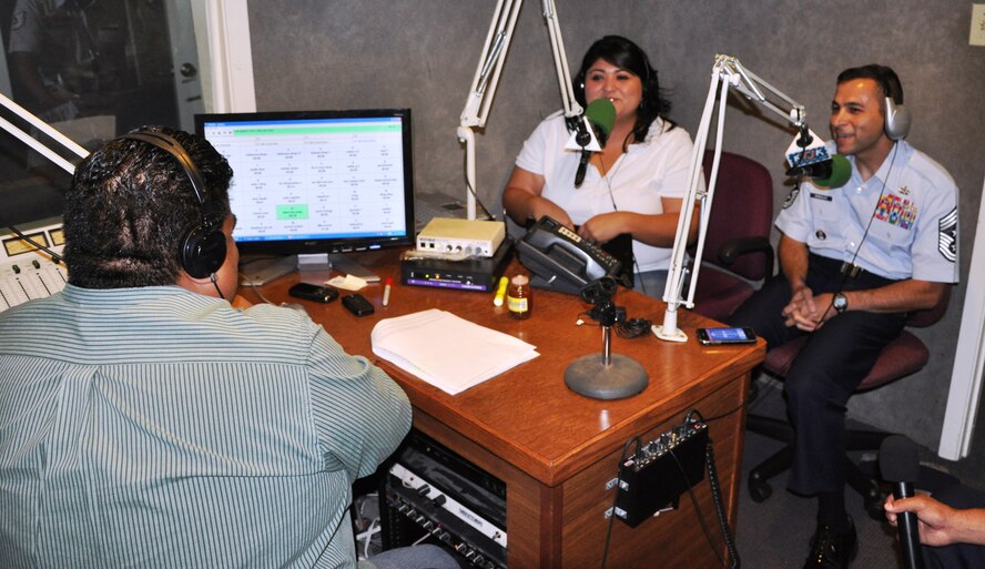 LAUGHLIN AIR FORCE BASE, Texas – Command Chief Master Sgt. Ruben Gonzalez, Air Force Recruiting Service command chief, shares a laugh with Jay Gonzalez of Del Rio’s KTJK during his morning show in Del Rio Aug. 19. Chief Gonzalez, who is from Eagle Pass and was recruited into the Air Force out of Del Rio in 1985, chose to begin his world-wide tour of AF recruiting stations with Del Rio. (U.S. Air Force photo by Airman 1st Class Blake Mize)