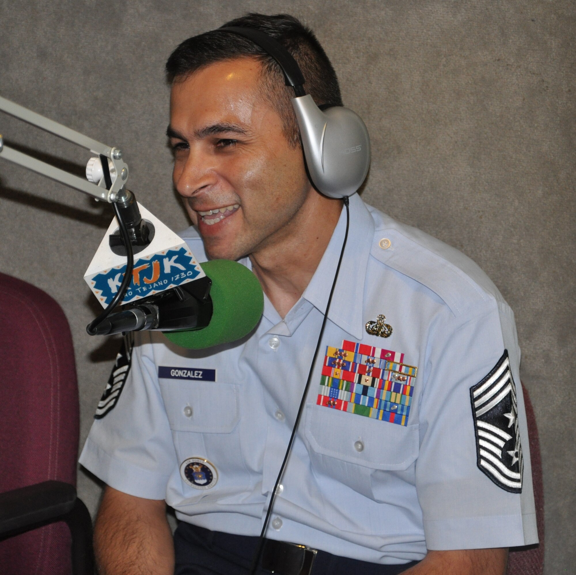 LAUGHLIN AIR FORCE BASE, Texas – Command Chief Master Sgt. Ruben Gonzalez, Air Force Recruiting Service command chief, shares a laugh with Jay Gonzalez of Del Rio’s KTJK during his morning show in Del Rio Aug. 19. Chief Gonzalez, who is from Eagle Pass and was recruited into the Air Force out of Del Rio in 1985, chose to begin his world-wide tour of AF recruiting stations with Del Rio. (U.S. Air Force photo by Airman 1st Class Blake Mize)