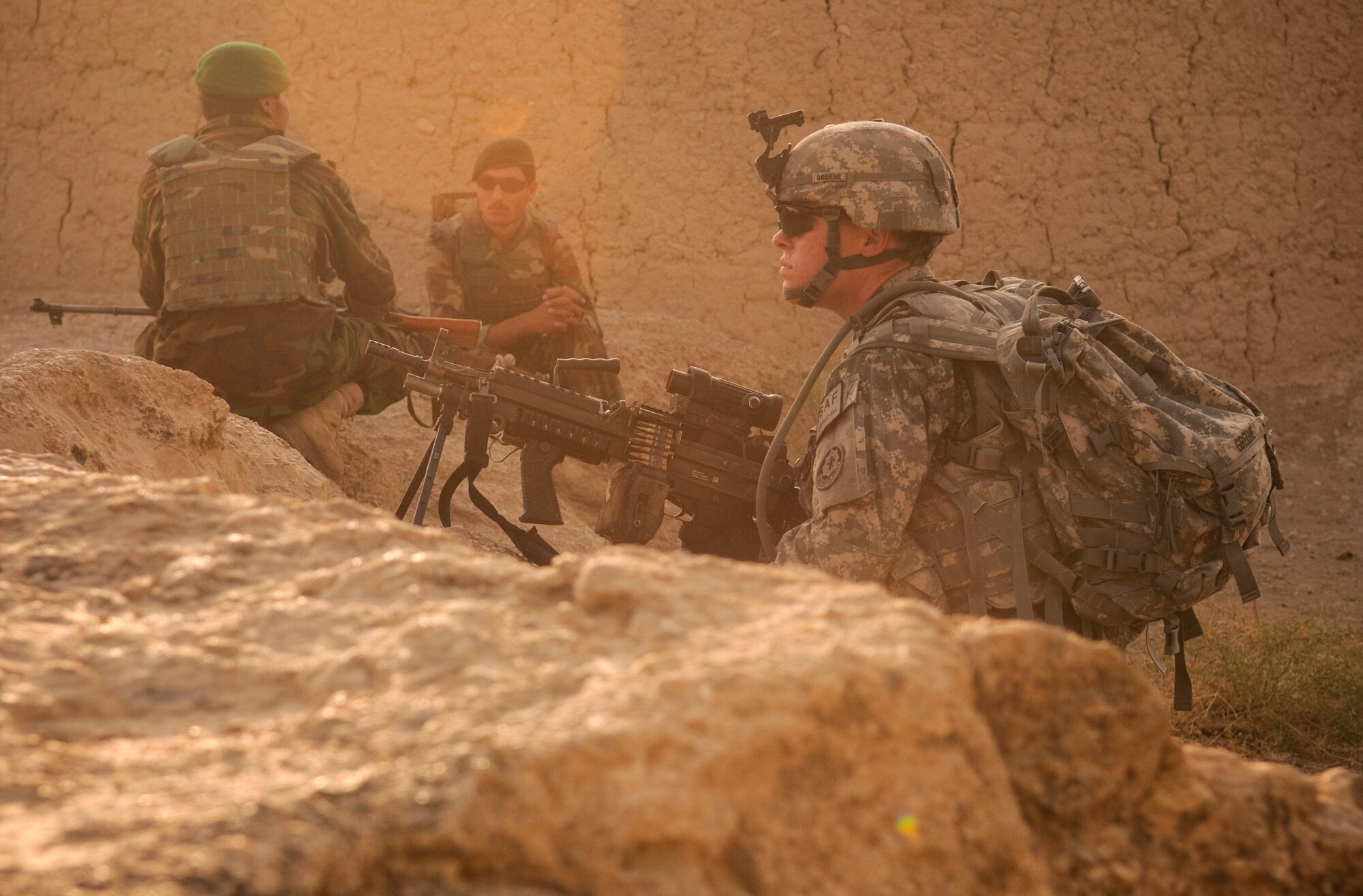 COMBAT OUTPOST MIZAN, Afghanistan - U.S. and Afghan forces provide security during a meeting with local elders in a village near Combat Outpost Mizan, Mizan District, Zabul province, Aug. 19, 2010. Members of Provincial Reconstruction Team Zabul and 3rd Platoon spoke with the local population to assess their needs and inform them of the upcoming provincial parliamentary elections. (U.S. Air Force photo/Senior Airman Nathanael Callon/Released)