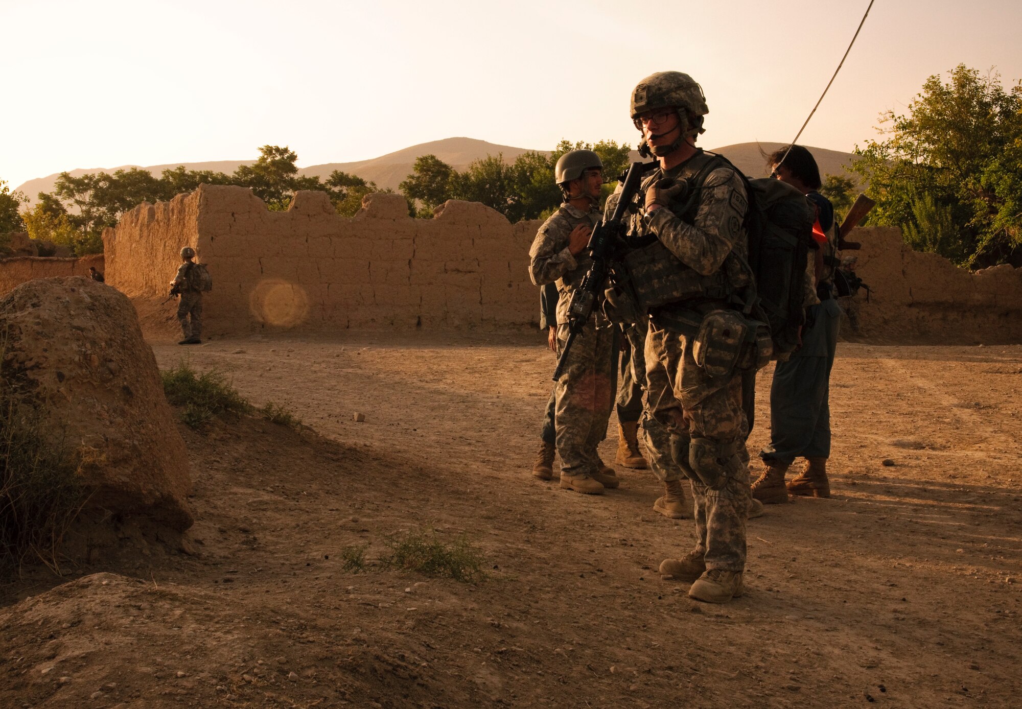 COMBAT OUTPOST MIZAN, Afghanistan - U.S. Army Pfc. Justin Cobbs, a radio operator assigned to 3rd Platoon, Fox Company, 2nd Squadron, 2nd Stryker Cavalry Regiment, makes contact with reconnaissance helicopters near Combat Outpost Mizan, Mizan District, Zabul province, Aug. 19, 2010. Members of Provincial Reconstruction Team Zabul and 3rd Platoon spoke with the local population to assess their needs and inform them of the upcoming provincial parliamentary elections.(U.S. Air Force photo/Senior Airman Nathanael Callon/Released)