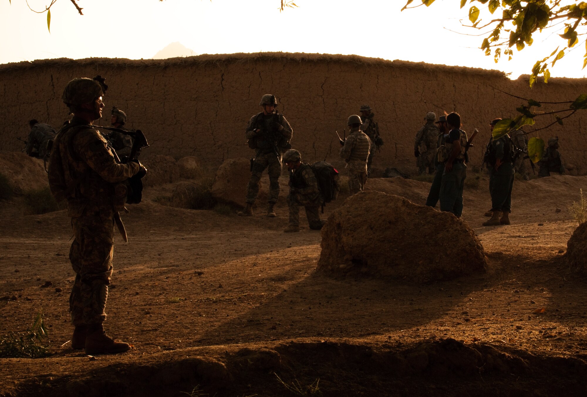 COMBAT OUTPOST MIZAN, Afghanistan - U.S. Army Capt. Cory Petro, left, Provincial Reconstruction Team Zabul district support unit leader and a native of Berlin, Pa., waits for local elders to arrive for a meeting near Combat Outpost Mizan, Mizan District, Zabul Province, Aug. 19. Members of PRT Zabul and 3rd Platoon, Fox Company, 2nd Squadron, 2nd Stryker Cavalry Regiment, spoke with the local population to assess their needs and inform them of the upcoming provincial parliamentary elections. (U.S. Air Force photo/Senior Airman Nathanael Callon/Released)