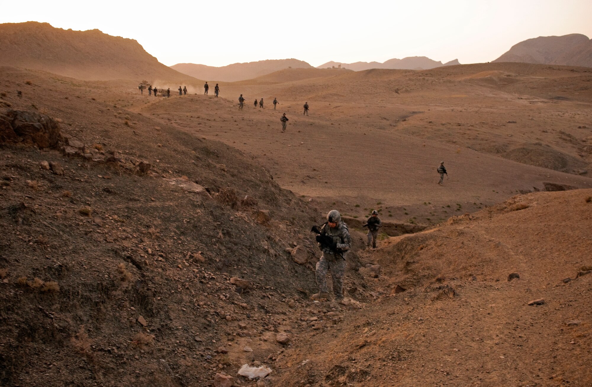 COMBAT OUTPOST MIZAN, Afghanistan - U.S. and Afghan forces conduct a dismounted patrol near Combat Outpost Mizan, Mizan District, Zabul province, Aug. 19, 2010. During the patrol, members of Provincial Reconstruction Team Zabul and 3rd Platoon, Fox Company, 2nd Squadron, 2nd Stryker Cavalry Regiment, spoke with the local population to assess their needs and inform them of the upcoming provincial parliamentary elections. (U.S. Air Force photo/Senior Airman Nathanael Callon/Released)