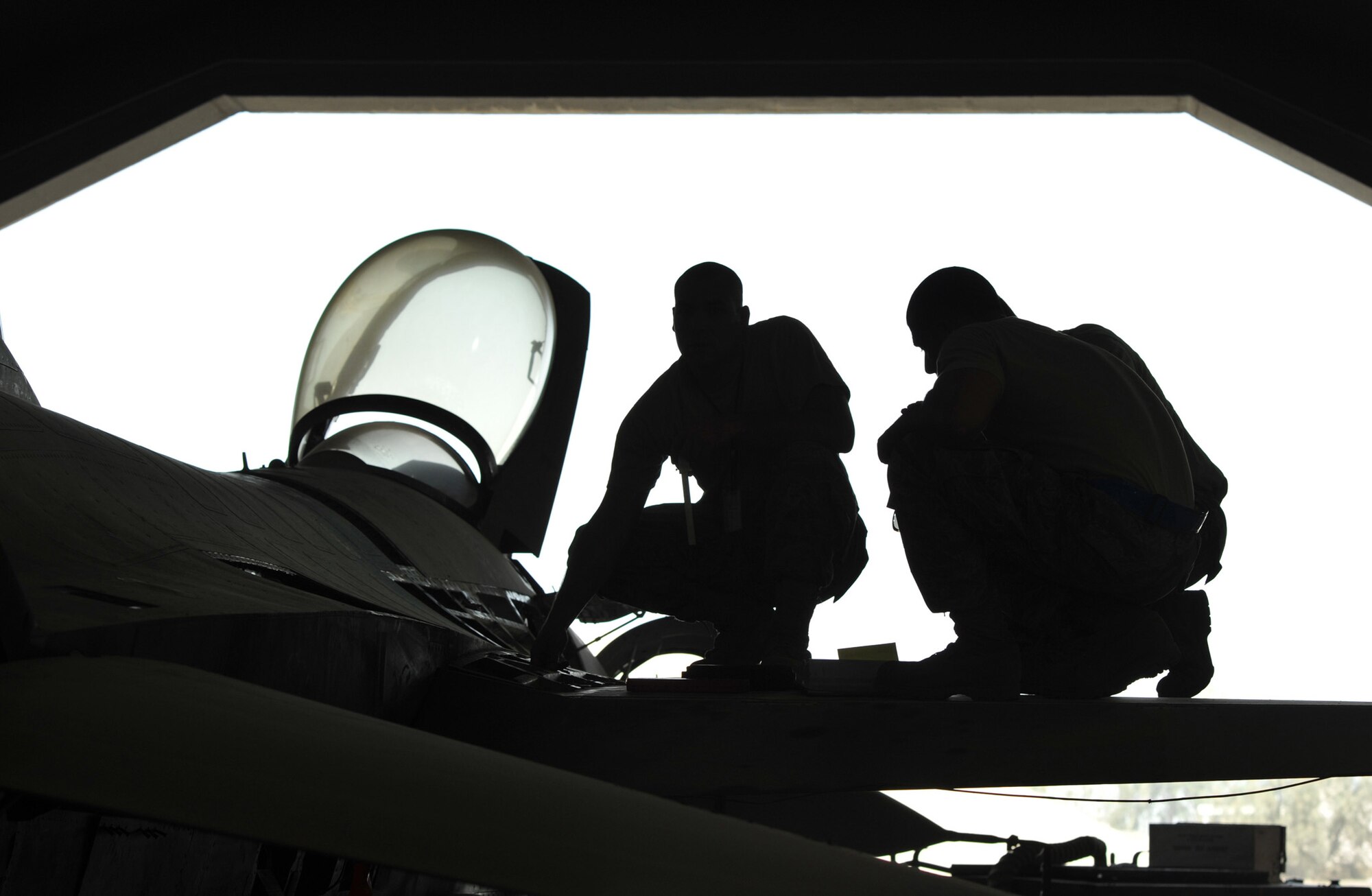 Aircraft mechanics of the 332nd Expeditionary Maintenance Squadron Phase Inspection Section check components on an F-16 Fighting Falcon for discrepancies during a 400-hour phase inspection Aug. 7, 2010 at Joint Base Balad, Iraq. Phase inspections are thorough programs of preventative maintenance and inspection performed on the fighter jets every 400, 800 and 2,400 flying hours. The Airmen and the aircraft are deployed from Shaw Air Force Base, S.C. (U.S. Air Force photo/Lt. Col. Robert Couse-Baker)