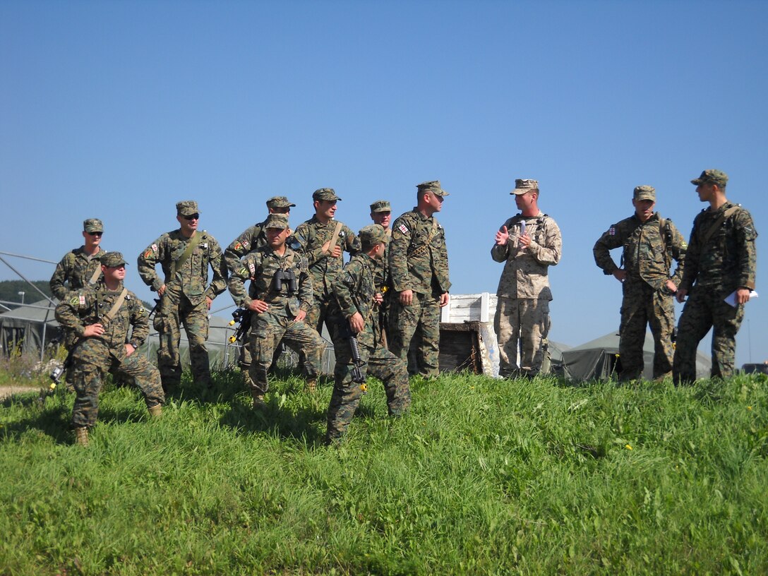 Capt. Patrick Forrest, with Supporting Arms Liaison Team, 2nd Air-Naval Gunfire Liaison Company, teaches a class to soldiers with the 32nd Georgian Infantry Battalion during a training exercise in Hohenfels, Germany. The month long training exercise was aimed at establishing familiarity between the two units, which will be working together during their upcoming deployment to Afghanistan.