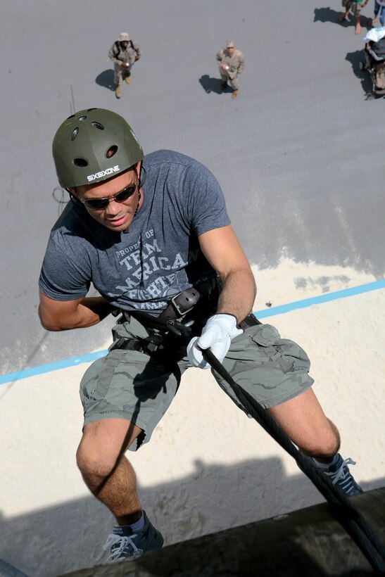 Professional Mixed Martial Arts fighter Rich Franklin prepares to rappel off the 60-foot Camp Hansen Rappel Tower, Aug. 22.