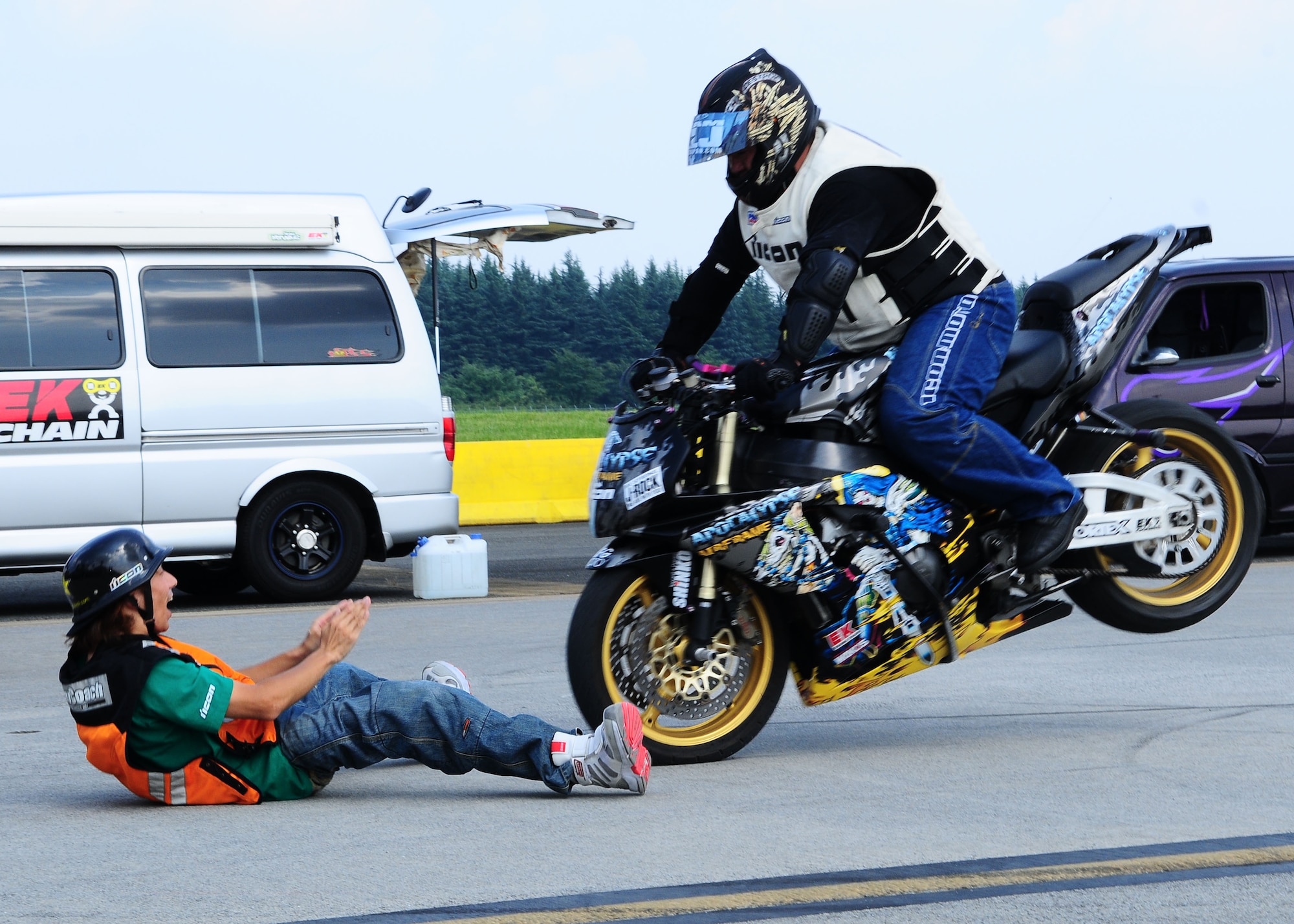 YOKOTA AIR BASE, Japan -- A member from No Limit Japan, a motorcycle stunt riding group, performs a stopping trick Aug. 21 during the 2010 Yokota Air Base Japanese-American Friendship Festival. Yokota Air Base hosts the festival annually to welcome the local Japanese citizens on the base to get a glimpse of the Yokota community.   (U.S. Air Force photo/Airman 1st Class Sean Martin)
