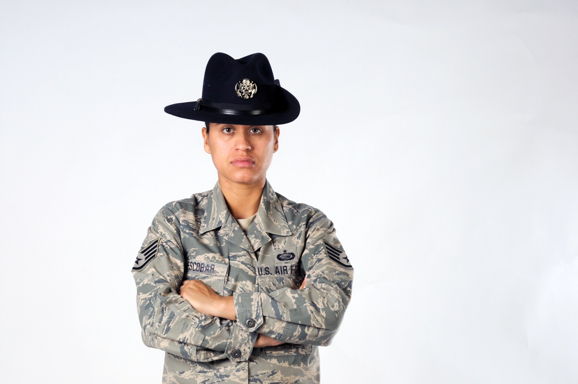 Staff Sgt. Maria Escobar poses for a photo in the 102nd Intelligence Wing's public affairs office on 8 Aug. 2010. Sergeant Escobar, a 102nd Force Support Squadron personnell specialist, recently became a Military Training Instructor and is bound for Lackland AFB, Texas.