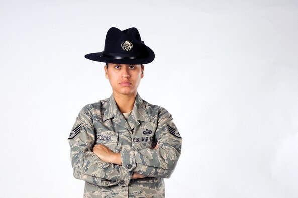 Staff Sgt. Maria Escobar poses for a photo in the 102nd Intelligence Wing's public affairs office on 8 Aug. 2010. Sergeant Escobar, a 102nd Force Support Squadron personnell specialist, recently became a Military Training Instructor and is bound for Lackland AFB, Texas.