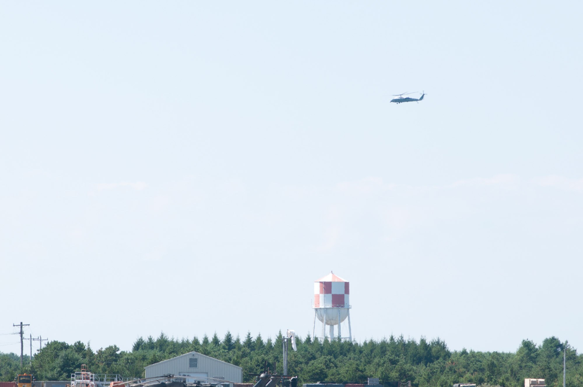 President Obama, in Marine One, passes over the water tower on the Mass. military reservation on August 19th 2010. The president stopped at Air Station Cape Cod before boarding Marine One bound for a vacation  Martha's Vineyard.