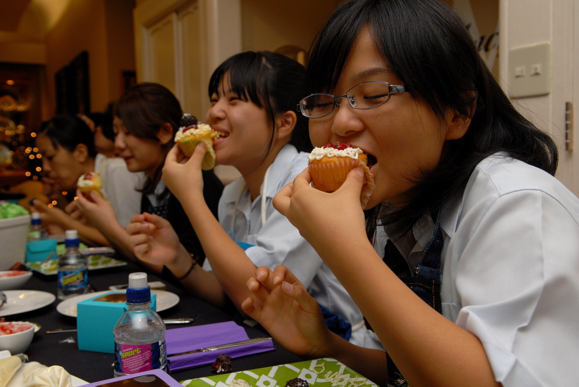 Students from the Junior and Senior High School Affiliated to Showa Pharmaceutical University enjoy their original creations after a cupcake decorating class at Kadena Air Base, Aug. 18. The students attended the event at the home of the 18th Wing Commander and were hosted by Mrs. Cindy Wilsbach. (U.S. Air Force Photo/Junko Kinjo)