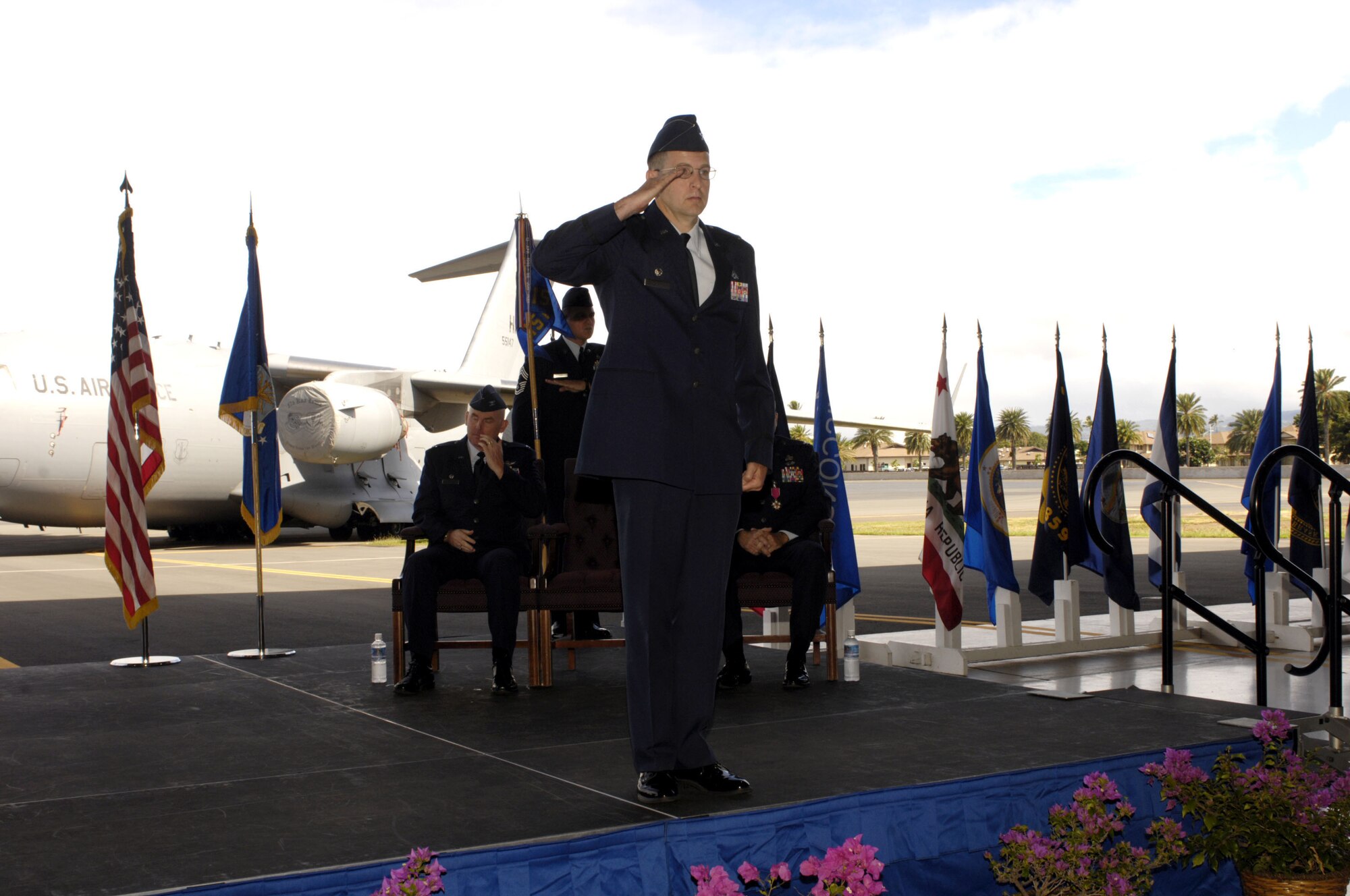 Colonel Michael J. Novotny accepts the guidon from Colonel Sam C. Barrett,
Commander, 15th Wing, Joint Base Pearl Harbor-Hickam, and assumes command of
the 15th Maintenance Group in a change of command ceremony Aug. 17at Joint Base Pearl Harbor Hickam, Hawaii.  Colonel Richard S. Marks is the out-going commander. (Photo by David D. Underwood, Jr.)
