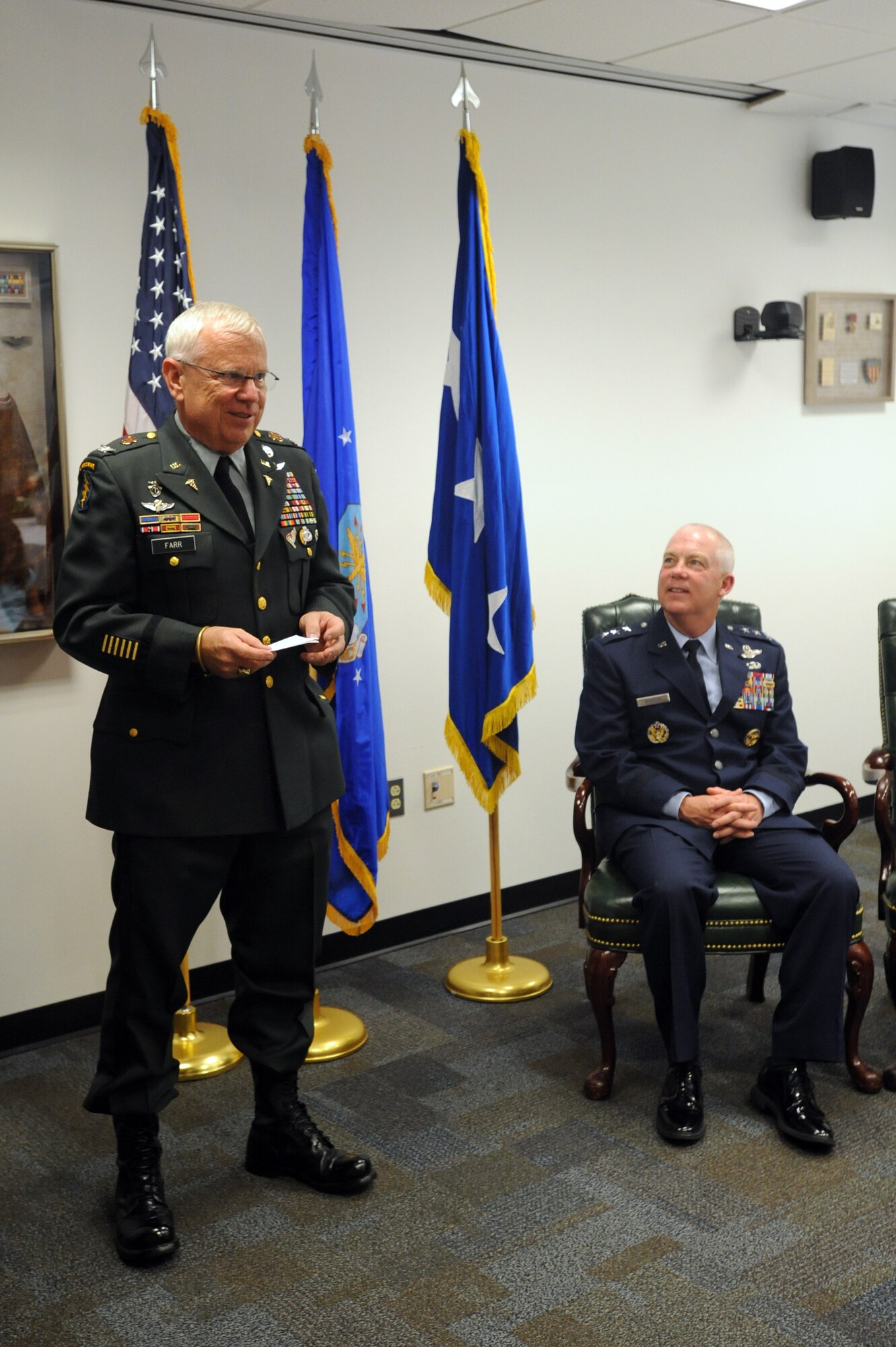 U.S. Army Col. Warner ?Rocky? Farr, Command Surgeon, U.S. Special Operations Command, speaks as Lt. Gen. Donald Wurster, Air Force Special Operations Command commander, looks on during Col. Charles ?Dahl? Farr's room dedication ceremony, at Hurlburt Field Fla., Aug 16, 2010. The room was dedicated in Col Charles "Dahl" Farr?s name, Colonel Farr fought in the China-Burma-India Theater in World War II and was one of the first to mount machine guns in the back of cargo planes to create gunships. (DoD Photo by U.S. Air Force Airman Caitlin O?Neil-McKeown/Released)
