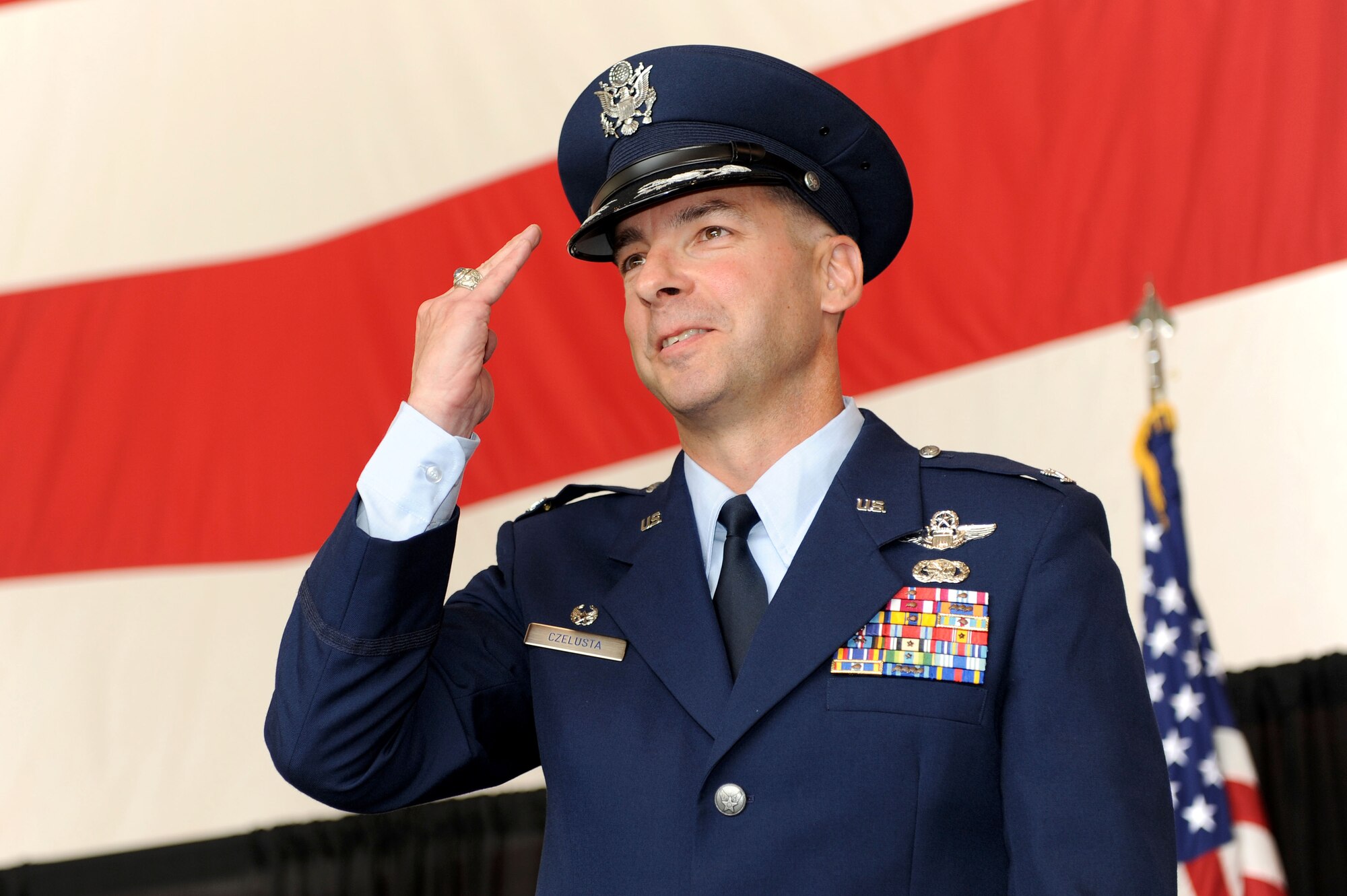 Col. Mark Czelusta, 314th Airlift Wing commander, renders his first salute to the men and women of the 314th AW Aug. 20 during a change-of-command ceremony on base. The 314th AW's mission is to train C-130 aircrew members from across the Department of Defense, Coast Guard and 38 nations, as well as C-21 aircrews through the 45th Airlift Squadron at Keesler Air Force Base, Miss. (U.S. Air Force photo by Senior Airman Steele C. G. Britton)