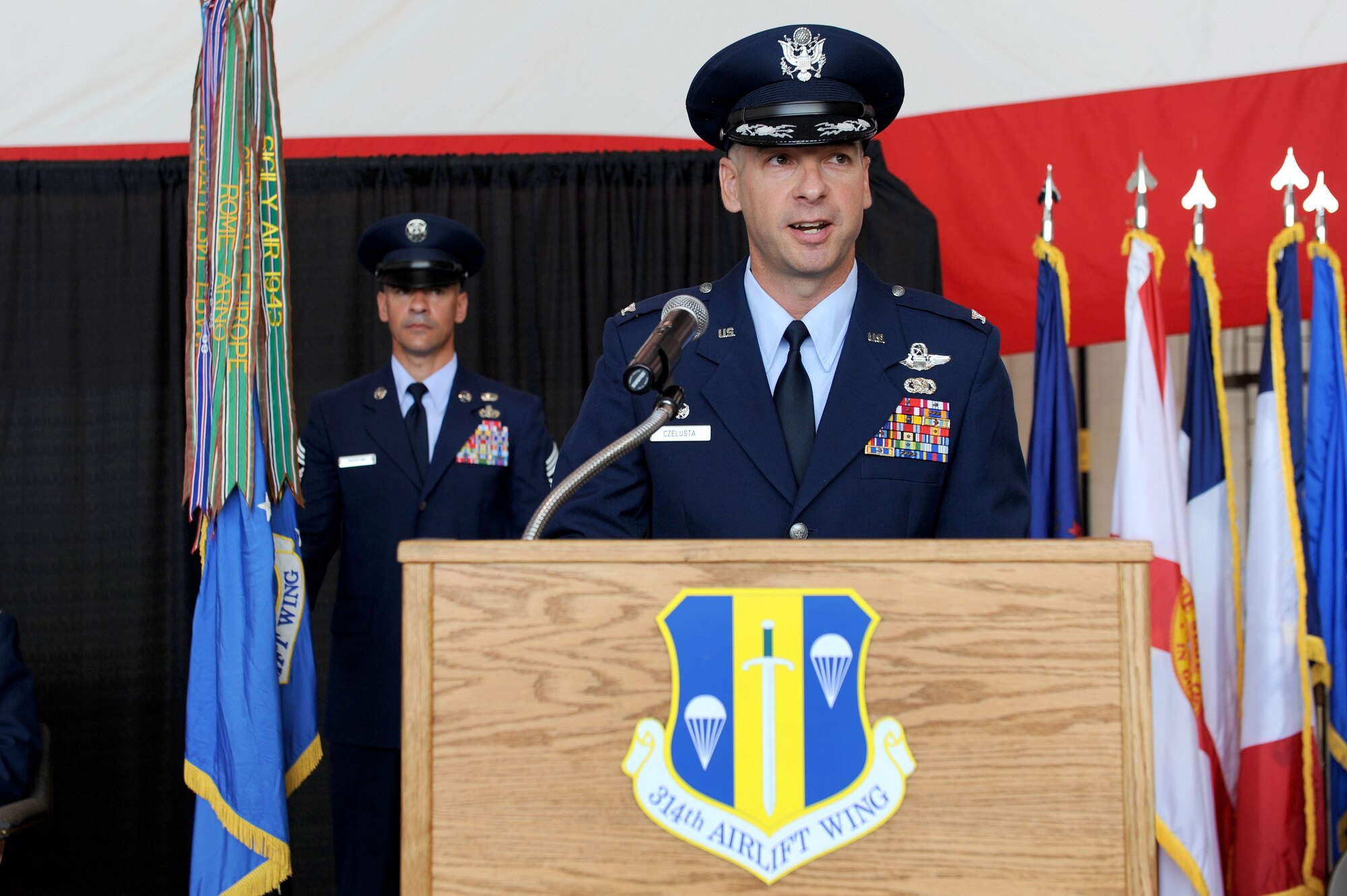 Col. Mark Czelusta, 314th Airlift Wing commander, speaks to those in attendance Aug. 20 during a change-of-command ceremony on base. Colonel Czelusta and his family have returned for their third tour to Little Rock Air Force Base, the home of C-130 Combat Airlift. (U.S. Air Force photo by Senior Airman Steele C. G. Britton)