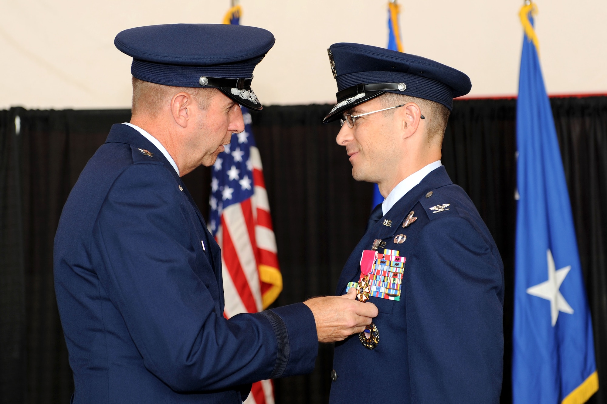 Maj. Gen. Mark S. Solo, 19th Air Force commander, presents the Legion of Merit to Col. Charles K. Hyde during a 314th Airlift Wing change-of-command ceremony Aug. 20 on base. The men and women of Team Little Rock bid farewell to Colonel Hyde after serving honorably as the wing's commander since Oct. 2008. (U.S. Air Force photo by Senior Airman Steele C. G. Britton)