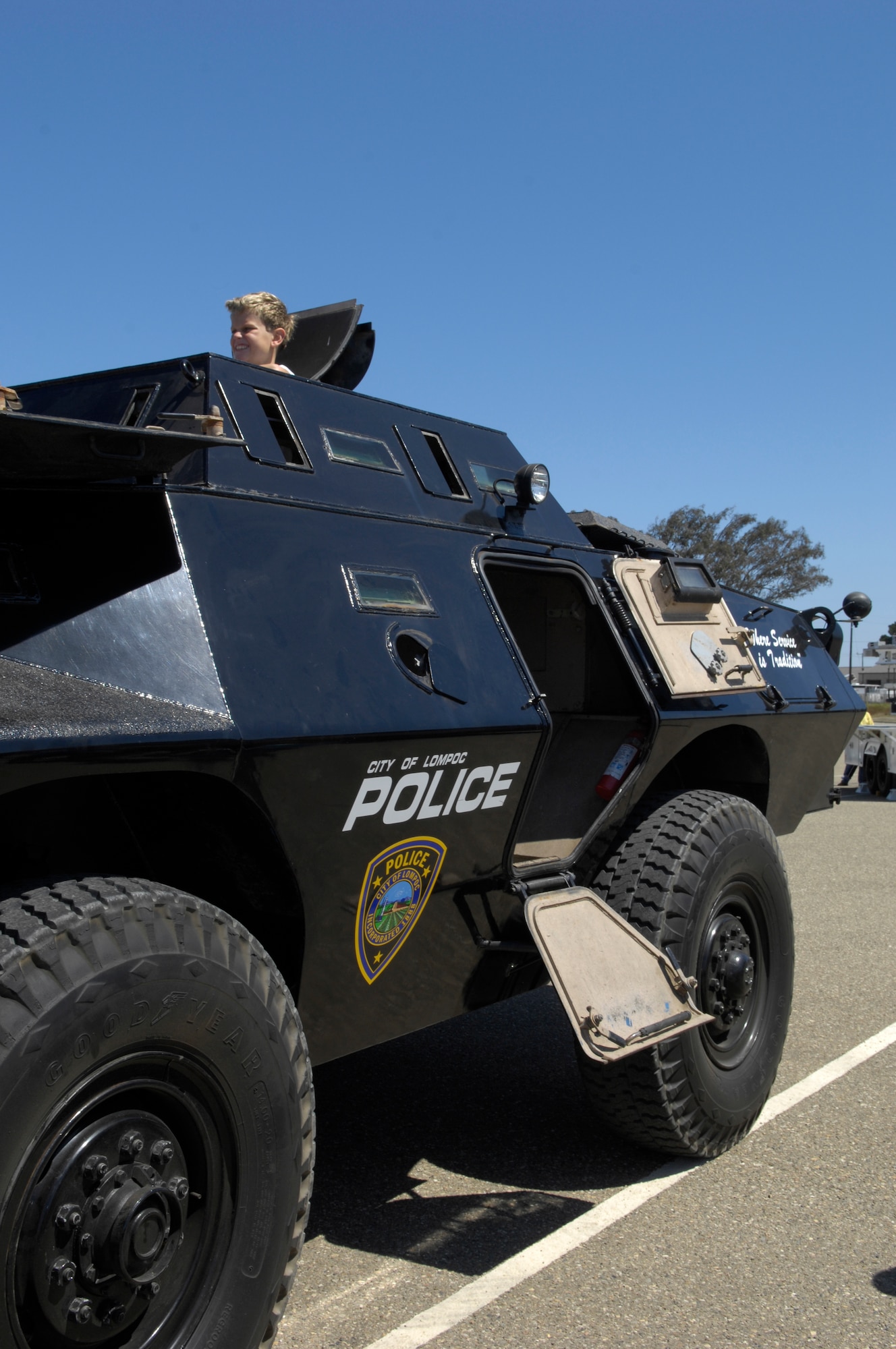 VANDENBERG AIR FORCE BASE, Calif. – Jacob Robinson views the scene from the top hatch of the Lompoc Police Department’s armored vehicle at the base’s annual Touch-a-Truck event here Saturday, Aug. 21, 2010. Touch-a-Truck is a family event, sponsored by the 30th Force Support Squadron and held in the 30th Logistics Readiness Squadron’s parking lot, which enables children to learn and operate various equipment that are used on base. (U.S. Air Force photo/Airman 1st Class Lael Huss)