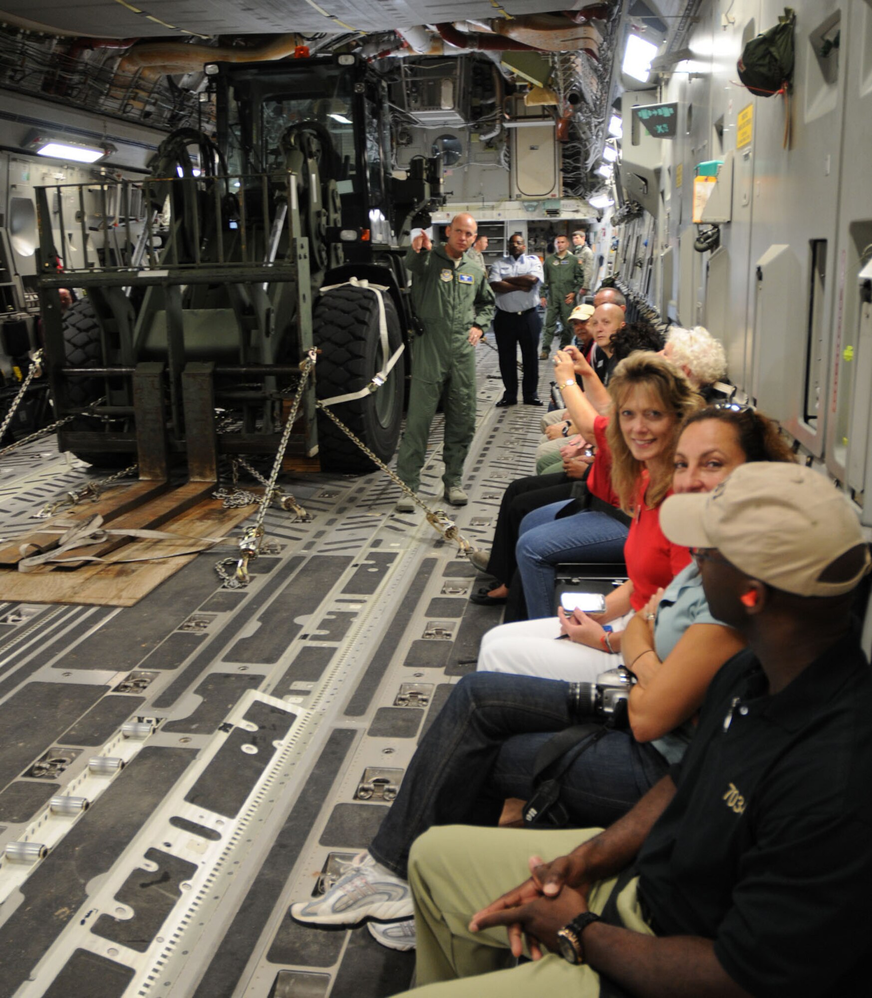 Col. Anthony B. Krawietz, 436th Airlift Wing vice commander, explains the capabilities of the C-17 Globemaster III to civic leaders attending the Honorary Commander orientation flight Aug. 16, 2010, at Dover Air Force Base, Del. Since 1992, more than 500 community leaders have had the chance to participate in the base?s Honorary Commanders Program and have flown in Dover's C-5 Galaxies or C-17s over the years. (U.S. Air Force photo/Capt. Marnee A.C. Losurdo)

