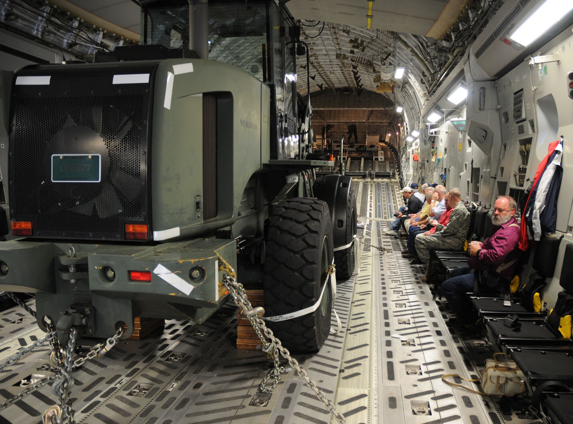 Twenty-four civic leaders flew on a C-17 Globemaster III Aug. 16, 2010, at Dover Air Force Base, Del. To show the hauling capacity of the airlifter, the aircrew demonstrated how cargo is removed by offloading a large fork lift, which had been chained to the cargo bay floor. Since 1992, more than 500 community leaders have had the chance to participate in the base?s Honorary Commanders Program and have flown in Dover's C-5 Galaxies or C-17s over the years. (U.S. Air Force photo/Capt. Marnee A.C. Losurdo)
