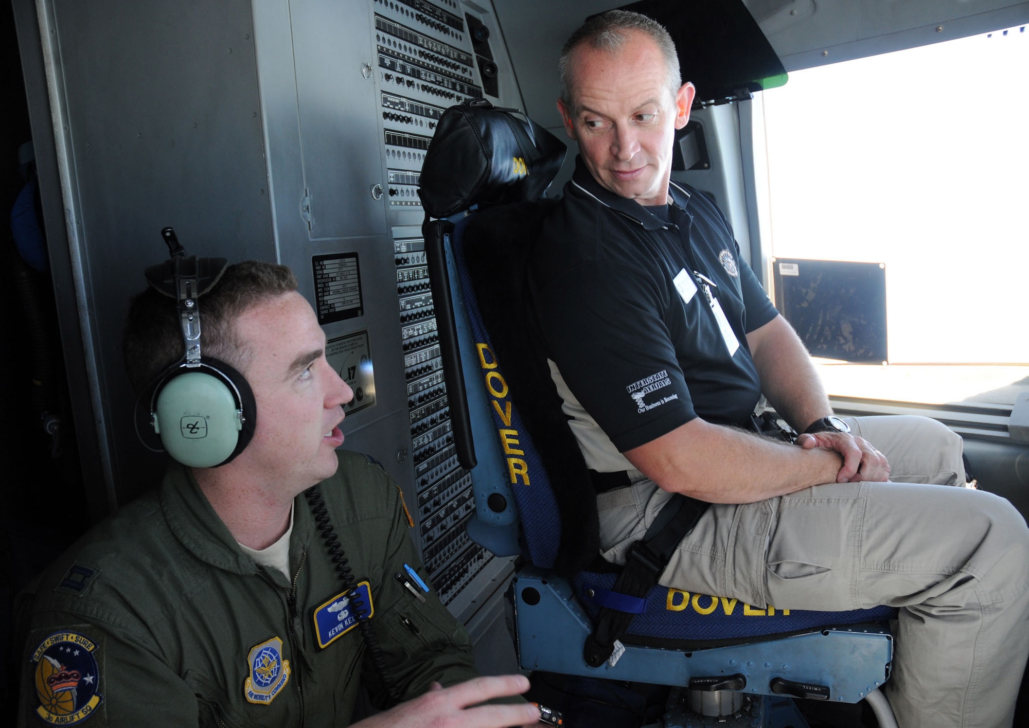Capt. Kevin Kelly, 3rd Airlift Squadron pilot, explains the process of aerial refueling to Col. Robert Coupe, Delaware State Police superintendent, during the Dover Air Force Base, Del., Honorary Commander C-17 orientation flight Aug. 16, 2010. The unique opportunity for local military and civilian leaders to join forces and learn about their equivalent career fields began at Dover in 1992. Since then, more than 500 community leaders have had the chance to participate in the base?s Honorary Commanders Program and have flown in Dover's C-5 Galaxies or C-17s over the years. (U.S. Air Force photo/Capt. Marnee A.C. Losurdo)
