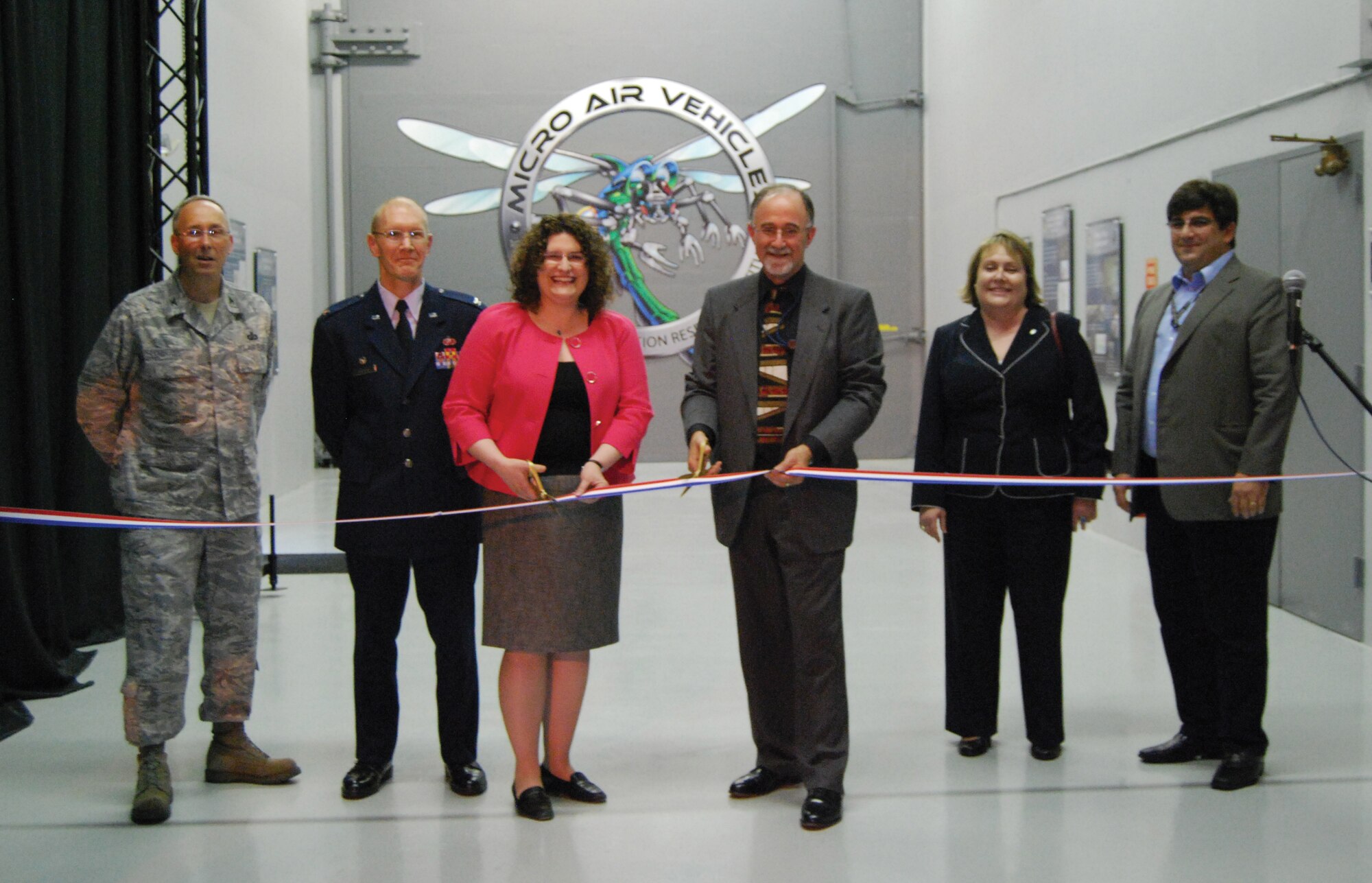 Colonel Kenneth L. Echternacht, Jr., AFRL Munitions Directorate, Director; Col. Michael C. Hatfield, AFRL Air Vehicles Directorate, Director; 
Dr. Leslie Perkins, AFRL Air Vehicles, Senior Principal Physical Scientist; Mr. Joe Sciabica, AFRL Executive Director; 
Ms. Susan J. Thornton, AFRL Directed Energy Directorate, Director; Dr. Gregg Abate, AFRL Munitions Directorate, MAV Chief Engineer (left to right) 
cut the ribbon on the Micro Air Vehicle Integration and Application Research Institute Indoor Flight Test Laboratory during a ceremony held May 27, 2010.