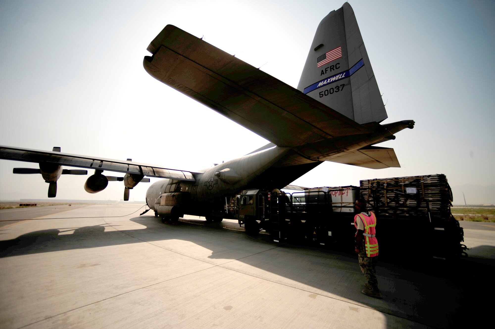 Airmen from the 746th Expeditionary Airlift Squadron load aid and supplies onto a C-130H Hercules in support of humanitarian relief efforts in Pakistan Aug. 20, 2010, at Bagram Airfield, Afghanistan. (U.S. Air Force photo/Staff Sgt. Andy M. Kin)
