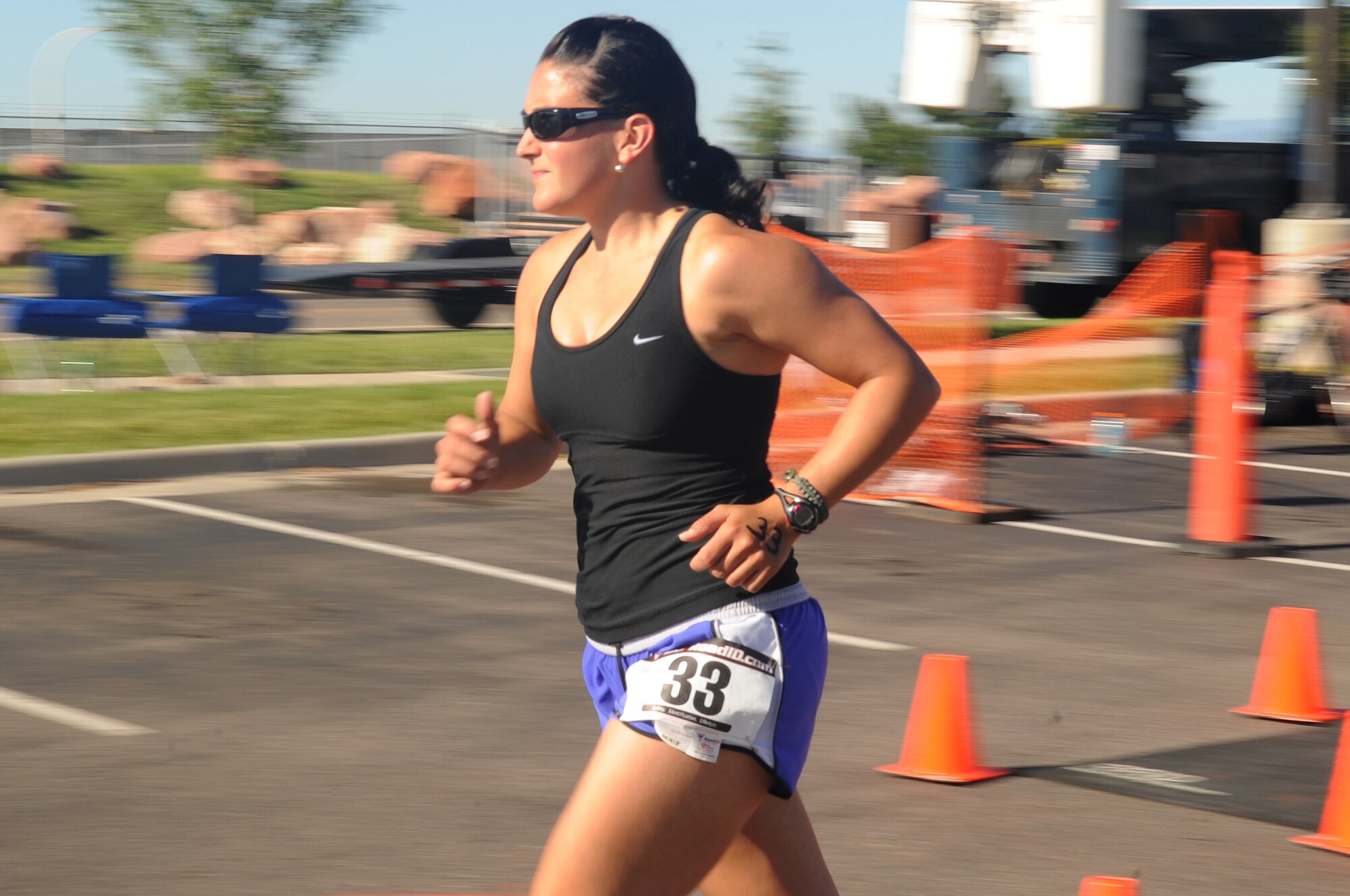 BUCKLEY AIR FORCE BASE, Colo. -- Tech. Sgt. Veronica Gatta starts off her three mile run at the Buckley Fit Fight Freedom Mini-Triathlon on August 22. The three-mile run was the last portion of the Triathlon, which also included a swim and bike ride. (U.S. Air Force Photo by Airman Manisha Vasquez) 