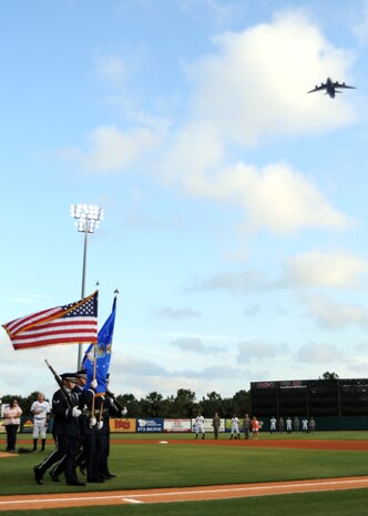 Joint Base Charleston Honor Guard members depart the Charleston RiverDogs baseball field after presenting the colors as a C-17 Globemaster III flies overhead during the military appreciation night opening ceremony Aug. 19, 2010, at Joseph P. Riley, Jr. Park in Charleston, S.C. The RiverDogs played against the Rome Braves from Georgia, who shutout Charleston?s team 4-0. It was the second consecutive shutout for the RiverDogs for the first time since July of 2008. (U.S. Air Force photo/Senior Airman Timothy Taylor)