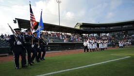 Members of the Joint Base Charleston Honor Guard march onto the Charleston RiverDogs baseball field to present the colors for the military appreciation night opening ceremony Aug. 19, 2010, at Joseph P. Riley, Jr. Park in Charleston, S.C. The RiverDogs and Force Protection, a local manufacturer of mine-resistant vehicles, joined together to recognize military members who've recently returned from deployment. The RiverDogs traditionally host two military appreciation nights a year and offer free tickets to servicemembers and their families. (U.S. Air Force photo/Senior Airman Timothy Taylor)