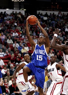 (Then) Cadet Antoine Hood drives the lane during a game against the University of Las Vegas during his junior year at the Air Force Academy.  Hood, now a captain with the 919th Special Operations Wing had a celebrated college basketball career at the Air Force Academy from 2002-2006, but has yet to realize his dream of playing in the NBA.  With his active-duty commitment now complete, the reservist says he’s ready to take the next step and make that dream a reality.  (U.S. Air Force photo by Master Sgt. Robert W. Valenca) 