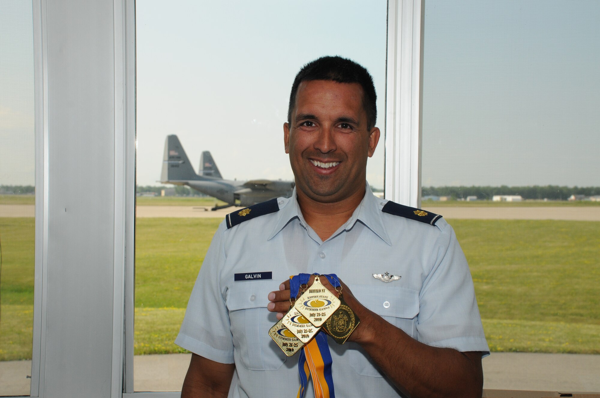 Maj. Michael Galvin, Pilot, 107th Airlift Wing, brings home not one but four gold medals in four different swimming heats. (U.S. Air Force photo/Staff Sgt. Peter Dean)