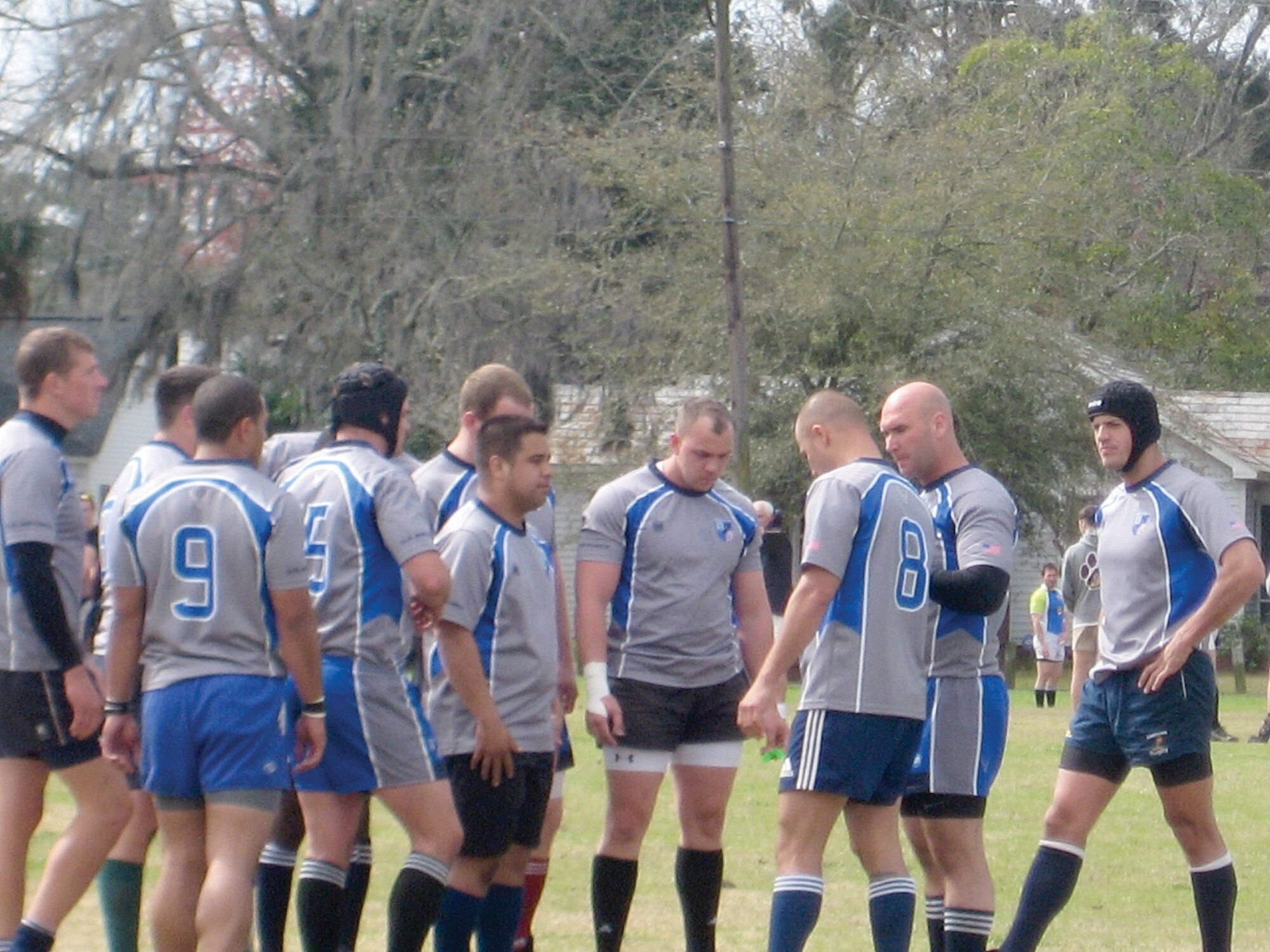 Tech. Sgt. Dustin Ballingham (center), 419th recruiter, confers with his teammates at the Air Force Rugby Mini Camp held in March. (Courtesy photo)