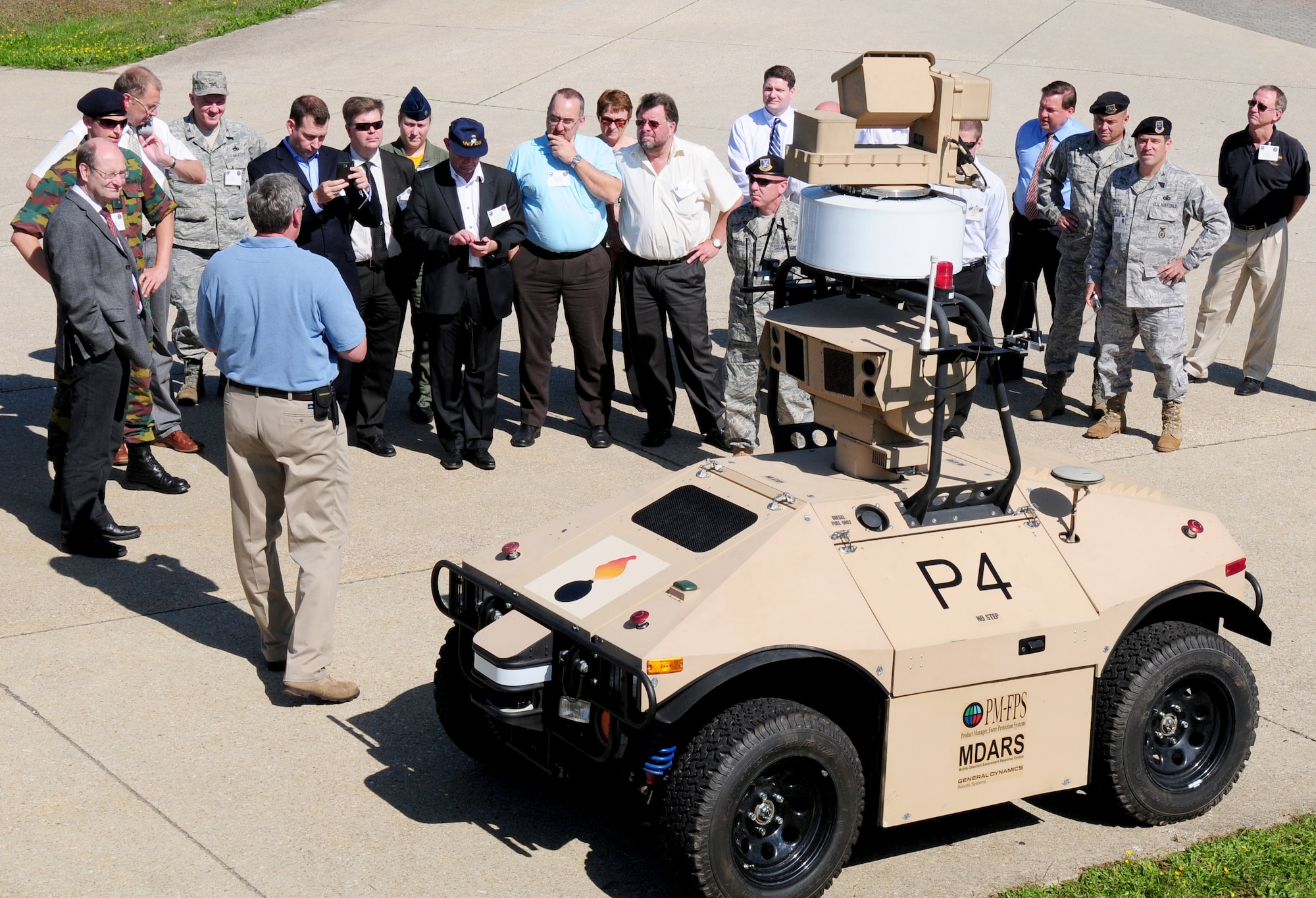 Guests attending the Joint Force Protection Advanced Security System demonstration receive information about a Mobile Detection Assessment Response System Aug. 20, 2010, at Spangdahlem Air Base, Germany. Spangdahlem AB is currently the only operational Department of Defense installation testing the advanced technology system geared toward enhancing force protection capabilities. (U.S. Air Force photo/Staff Sgt. Heather M. Norris)

