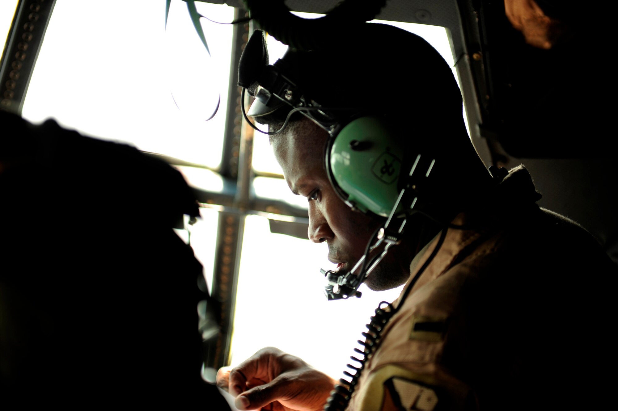 U.S. Air Force 1Lt. Jonathan Lipsey a C-130H Hercules navigator assigned to the 746th Expeditionary Airlift Squadron, looks over maps during flying mission in support of humanitarian relief efforts in Pakistan on Aug. 20, 2010. Members of the 746th EAS are running mission to Pakistan out of Bagram Airfield, Afghanistan. (U.S. Air Force photo by Staff Sgt. Andy M. Kin/Released)