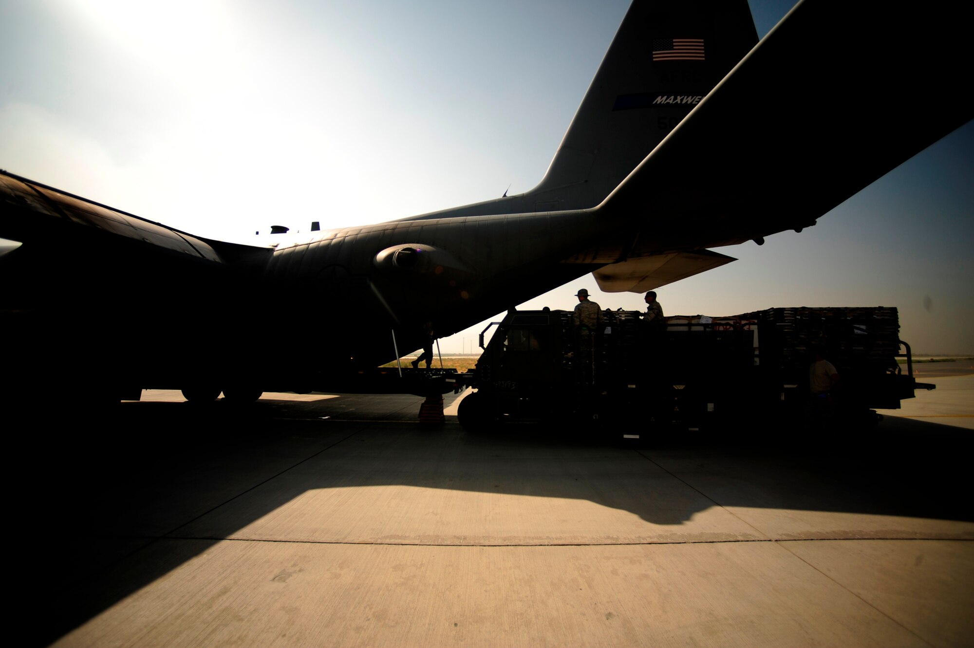 U.S. Air Force Airmen from the 746th Expeditionary Airlift Squadron load aid and supplies onto a C-130H Hercules aircraft, in support of humanitarian relief efforts in Pakistan at Bagram Airfield, Afghanistan, Aug. 20, 2010. (U.S. Air Force photo by Staff Sgt. Andy M. Kin/Released)