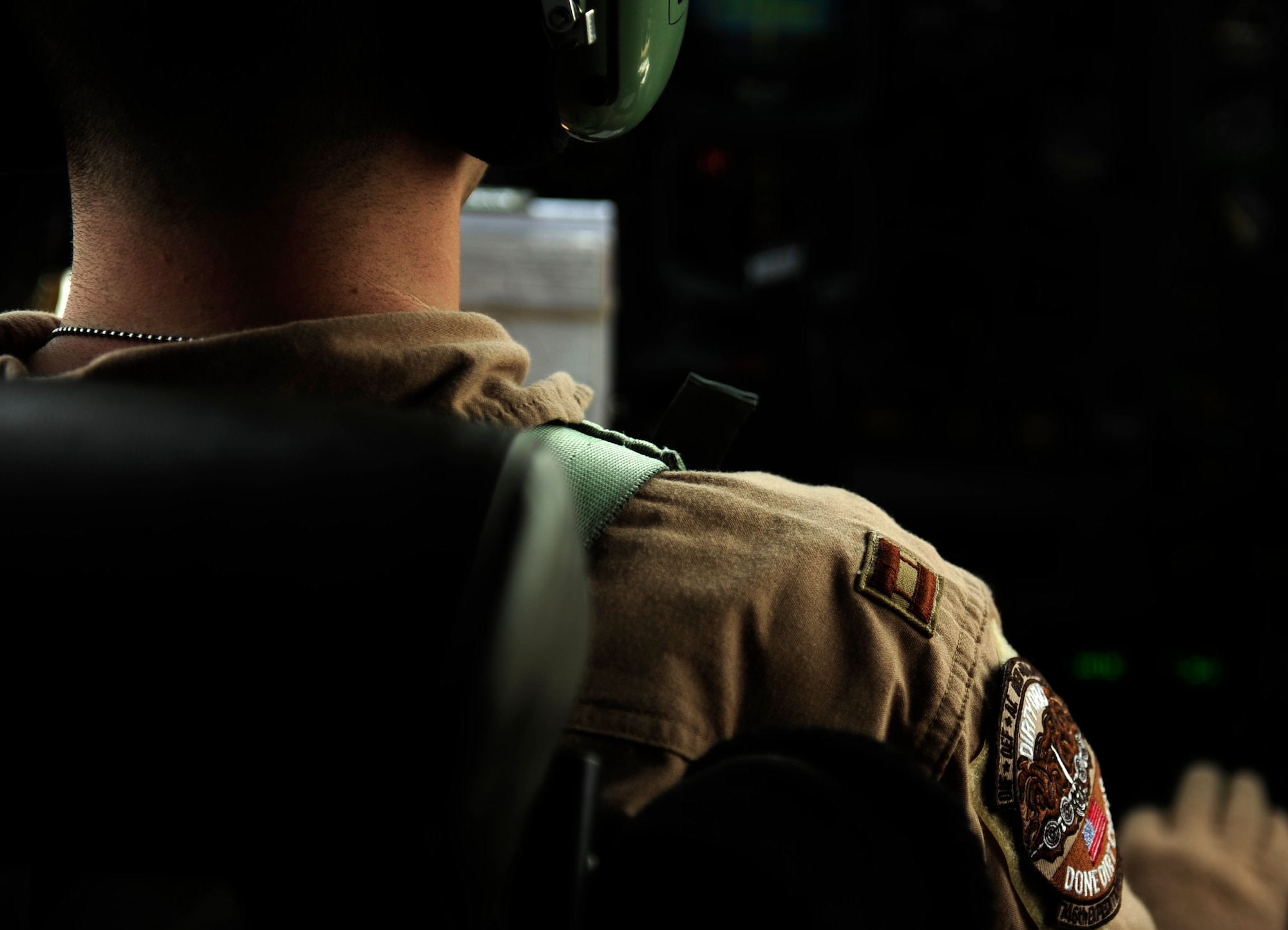 U.S. Air Force Capt. David Kemp, a C-130H Hercules pilot assigned to the 746th Expeditionary Airlift Squadron, sits at the controls during a flying mission in support of humanitarian relief efforts for Pakistan Aug. 20, 2010. The 746 EAS is staged out of Bagram Airfield, Afghanistan, and run mission to Pakistan daily. (U.S. Air Force photo by Staff Sgt. Andy M. Kin/Released)