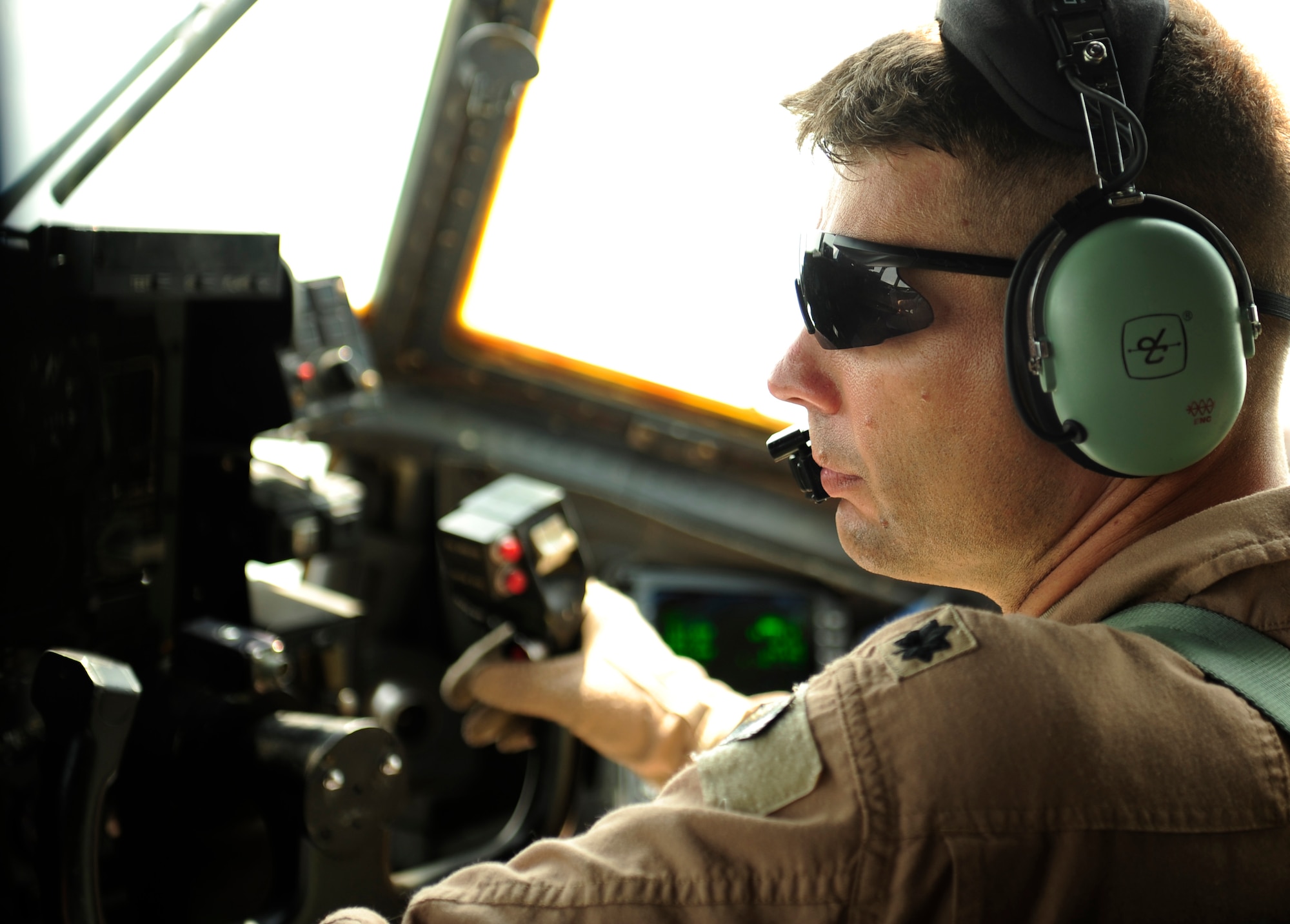 U.S. Air Force Lt Col. Kenneth Ostrat, a C-130H pilot assigned to the 746th Expeditionary Airlift Squadron, co-pilots during humanitarian relief missions to Pakistan from Bagram Airfield, Afghanistan, Aug. 20, 2010. (U.S. Air Force photo by Staff Sgt. Andy M. Kin/Released)