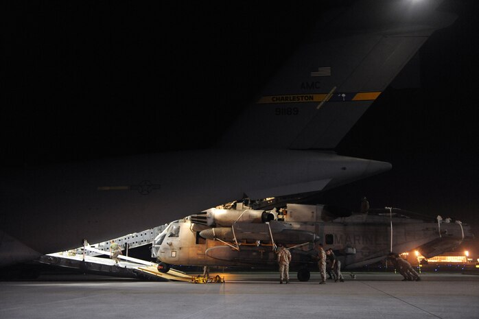 C-17A Globemaster III loadmasters assigned to the14th Airlift Squadron and U.S. Marines assigned to the 266th Medium Tilt Rotor Squadron load a MH-53E Super Stallion into a C-17A aircraft , Aug. 20, 2010 at Marine Corps Air Station Cherry Point, NC. The mission is in support of the Pakistan flood relief efforts. (U.S. Air Force photo/Staff Sgt. Manuel J. Martinez)