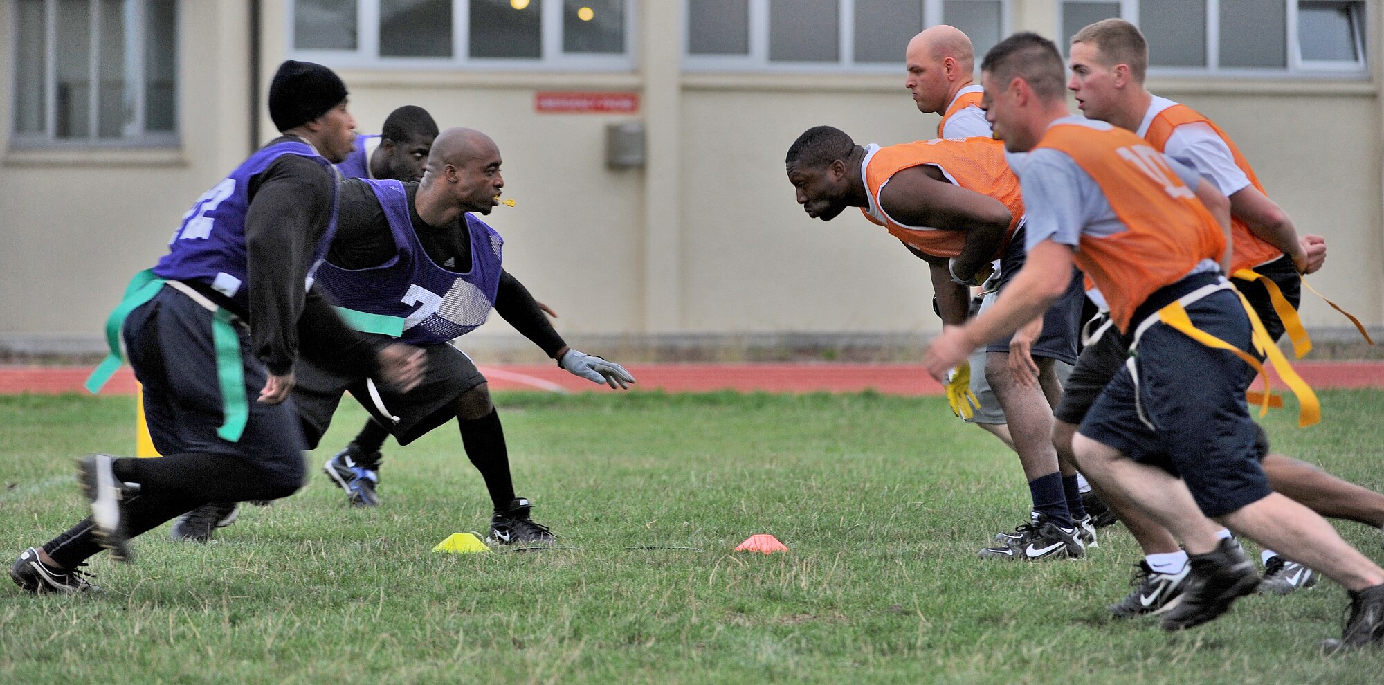 SPANGDAHLEM AIR BASE, Germany – Defenders from the combined 52nd Force Support Squadron and Maintenance Operation Squadron intramural flag football team (left ), attempt to prevent members from the the726th Air Mobility Squadron from scoring a touchdown 5 yards from the goal line Aug. 17 during a flag football game. The 52nd FSS/MOS defeated the 726th Air Mobility Squadron in overtime 14-13. (U.S. Air Force photo/Senior Airman Nick Wilson)