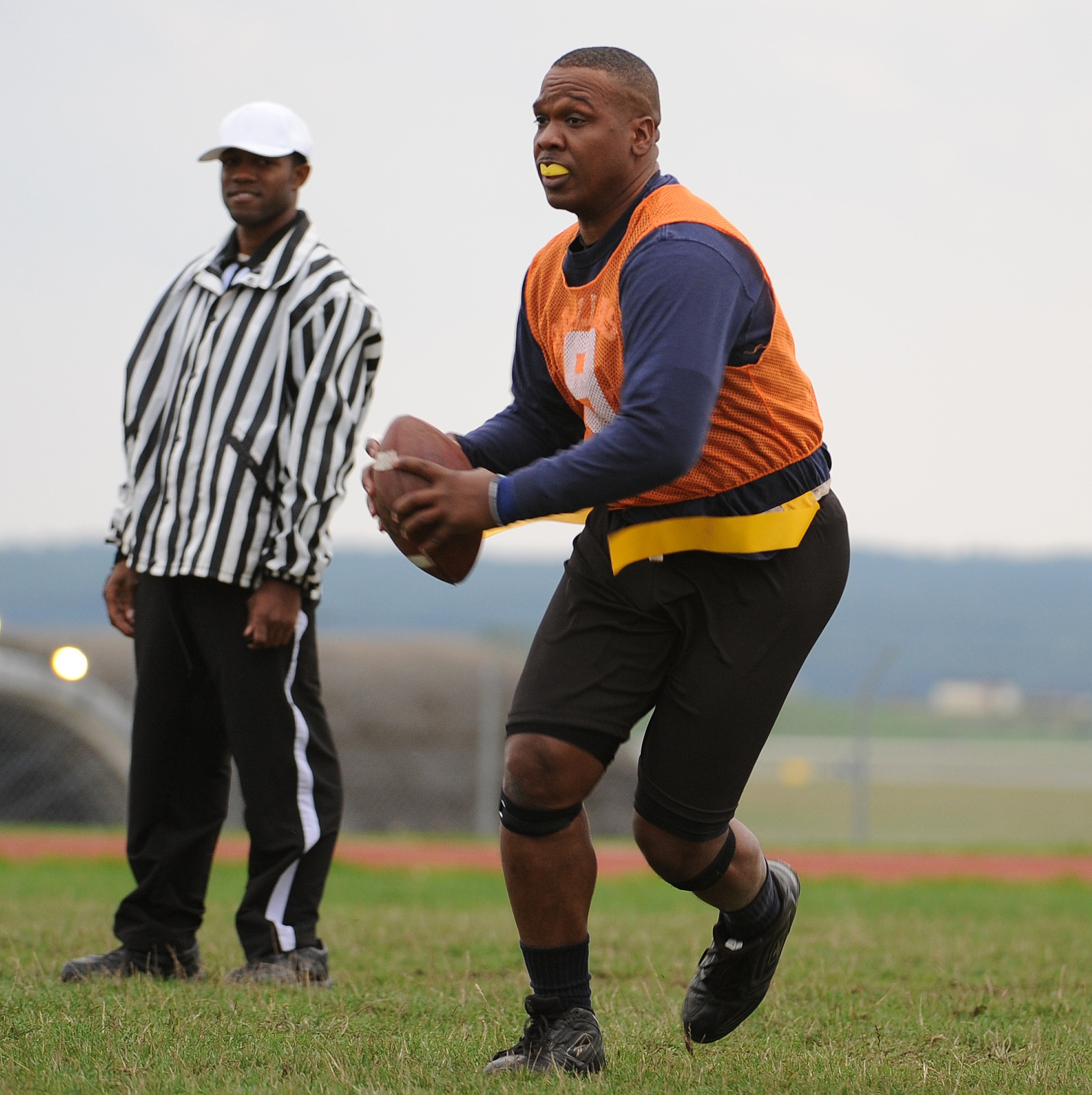 SPANGDAHLEM AIR BASE, Germany - Benjamin Wynn, 726th Air Mobility Squadron intramural football team quarterback scans the field for open team mates Aug 17. The 52nd FSS/MOS defeated the 726th Air Mobility Squadron in overtime 14-13. (U.S. Air Force photo/Senior Airman Nick Wilson)