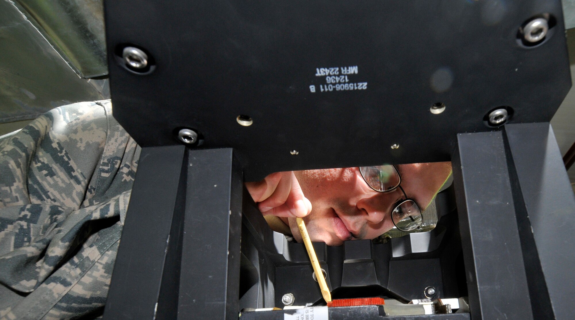 Staff Sgt. Christopher Francis, 332nd Expeditionary Maintenance Squadron F-16 Avionics Intermediate Shop repair technician, inspects a heads-up display’s circuit card for signs of any electrical shorts Aug. 6, 2010, Joint Base Balad, Iraq. The HUD is the primary display for pilots in the F-16 Fighting Falcon. Sergeant Francis, a native of Aiken, S.C., is deployed from McEntyre Joint National Guard Base, S.C. (U.S. Air Force photo/Staff Sgt. Phillip Butterfield)