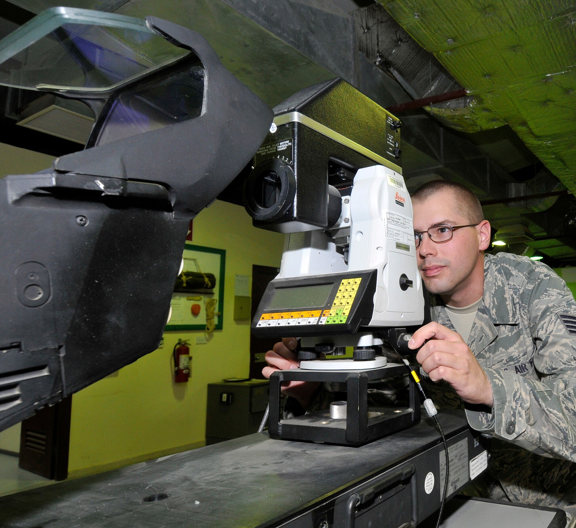 Staff Sgt. Christopher Francis, 332nd Expeditionary Maintenance Squadron F-16 Avionics Intermediate Shop repair technician, inspects sight alignment and symbology in a heads-up display for proper eye alignment and clarity Aug. 6, 2010, Joint Base Balad, Iraq. The HUD display is the primary display for aircraft instrumentation for pilots in the F-16 Fighting Falcon. Sergeant Francis, a native of Aiken, S.C., is deployed from McEntyre Joint National Guard Base, S.C. (U.S. Air Force photo/Staff Sgt. Phillip Butterfield)