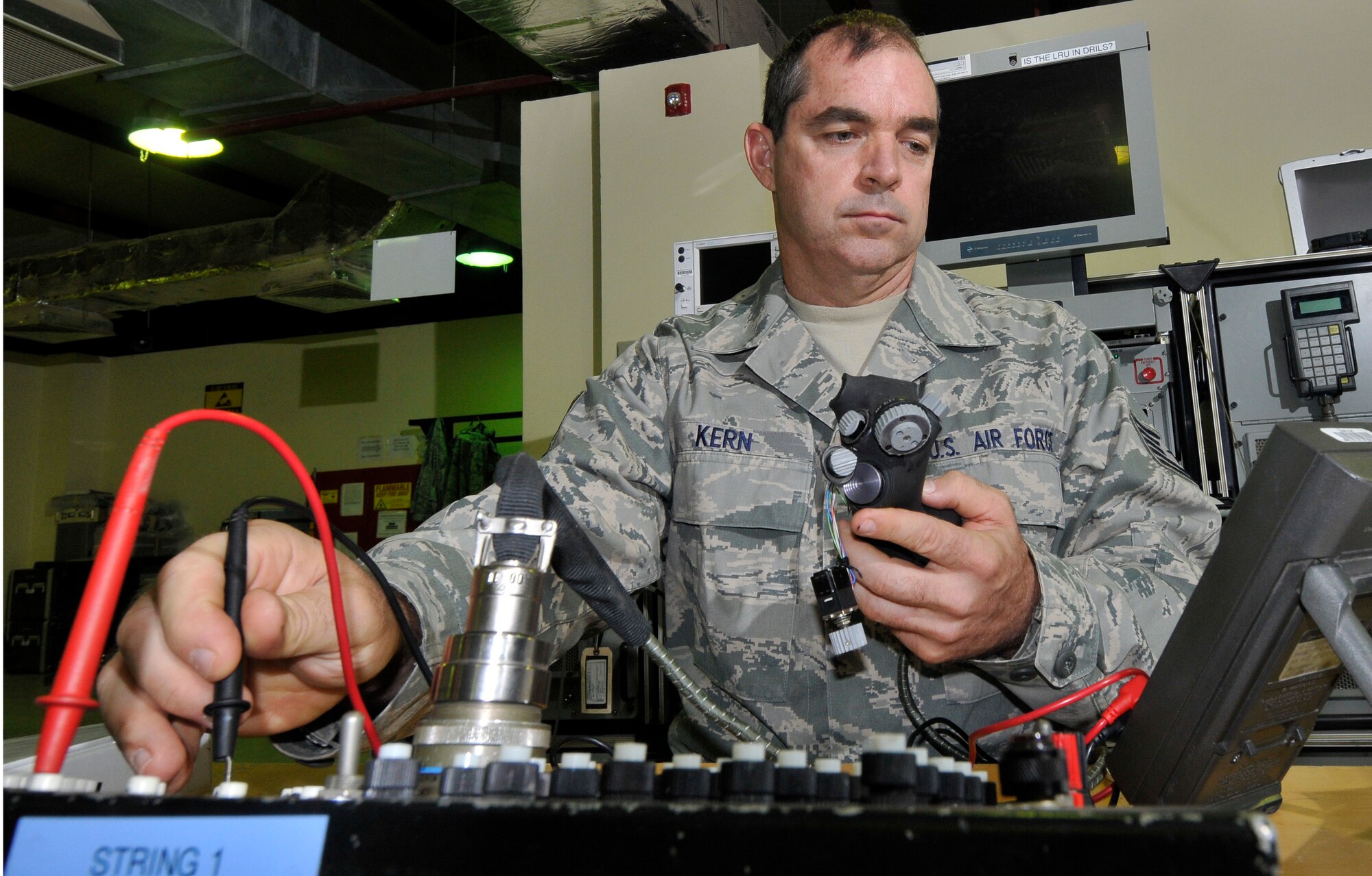 Tech. Sgt. Kary Kern, 332nd Expeditionary Maintenance Squadron F-16 Avionics Intermediate Shop team leader, troubleshoots and adjusts switches on an F-16 Fighting Falcon throttle grip Aug. 6, 2010, Joint Base Balad, Iraq. Sergeant Kern, a native of Walhalla, S.C., is deployed from McEntyre Air National Guard, S.C. (U.S. Air Force photo/Staff Sgt. Phillip Butterfield)